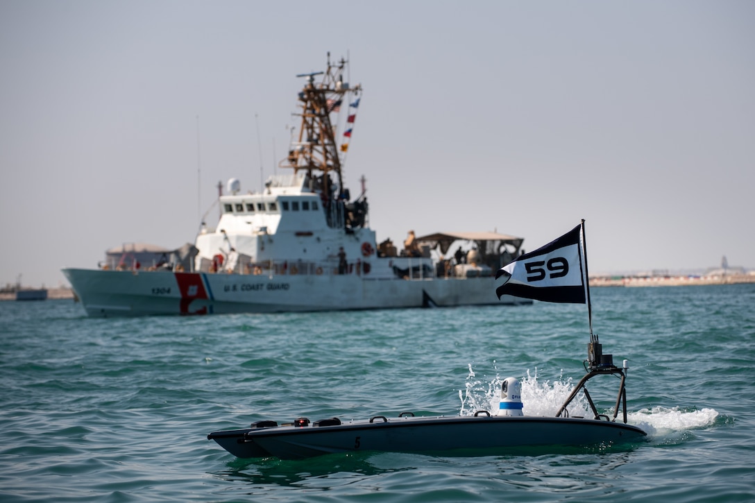 A MANTAS T-12 unmanned surface vessel (USV), front, operates alongside U.S. Coast Guard patrol boat USCGC Maui (WPB 1304) during exercise New Horizon in the Arabian Gulf, Oct. 26. Exercise New Horizon was U.S. Naval Forces Central Command Task Force 59’s first at-sea evolution since its establishment Sept. 9.
