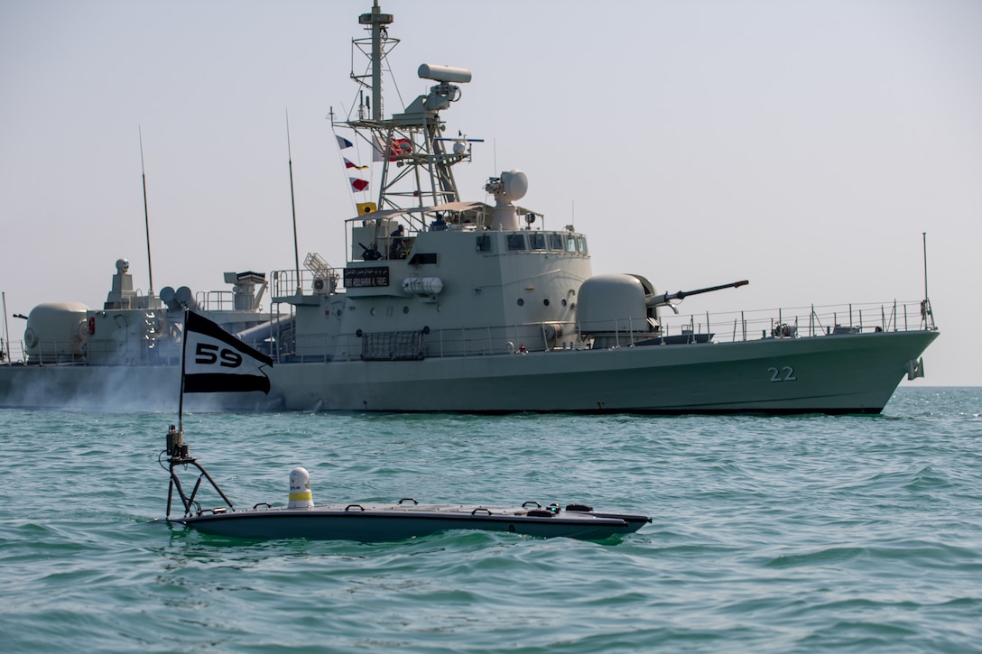 A MANTAS T-12 unmanned surface vessel (USV), front, operates alongside Royal Bahrain Naval Force fast-attack craft RBNS Abdul Rahman Al-fadel (P 22) during exercise New Horizon in the Arabian Gulf, Oct. 26. Exercise New Horizon was U.S. Naval Forces Central Command Task Force 59’s first at-sea evolution since its establishment Sept. 9.