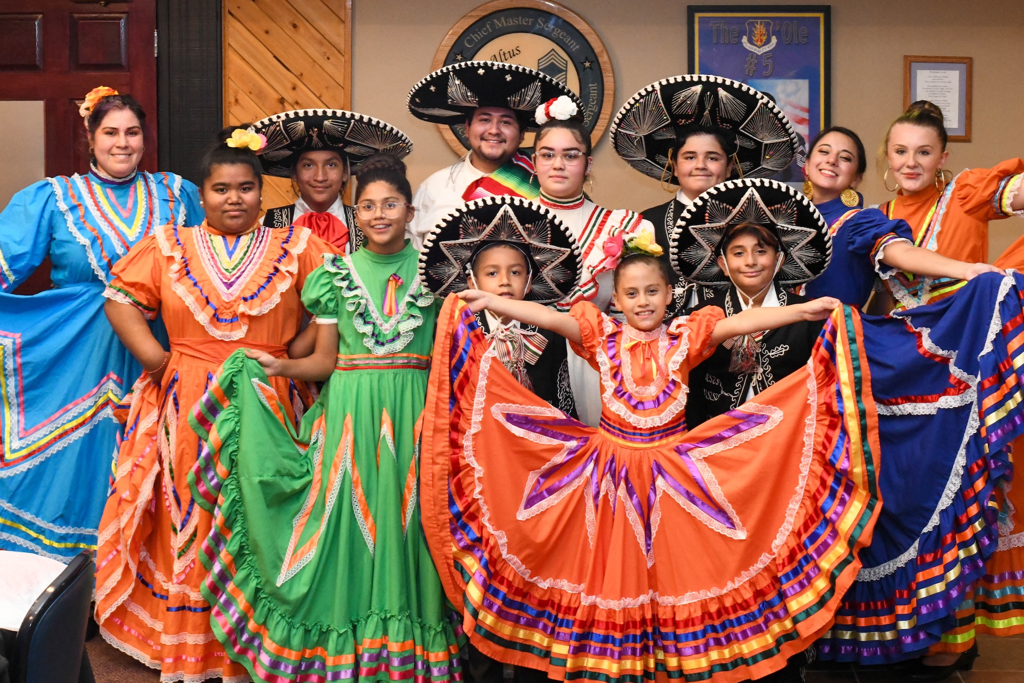 The Lawton Mexican Folkloric Dance group poses for a photo on Altus Air Force Base, Oklahoma, October 15, 2021. The nonprofit group performs for many schools and festivals in the local region. (U.S. Air Force photo by Airman 1st Class Trenton Jancze)