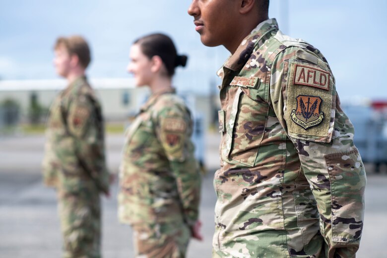 Airmen stand in a row