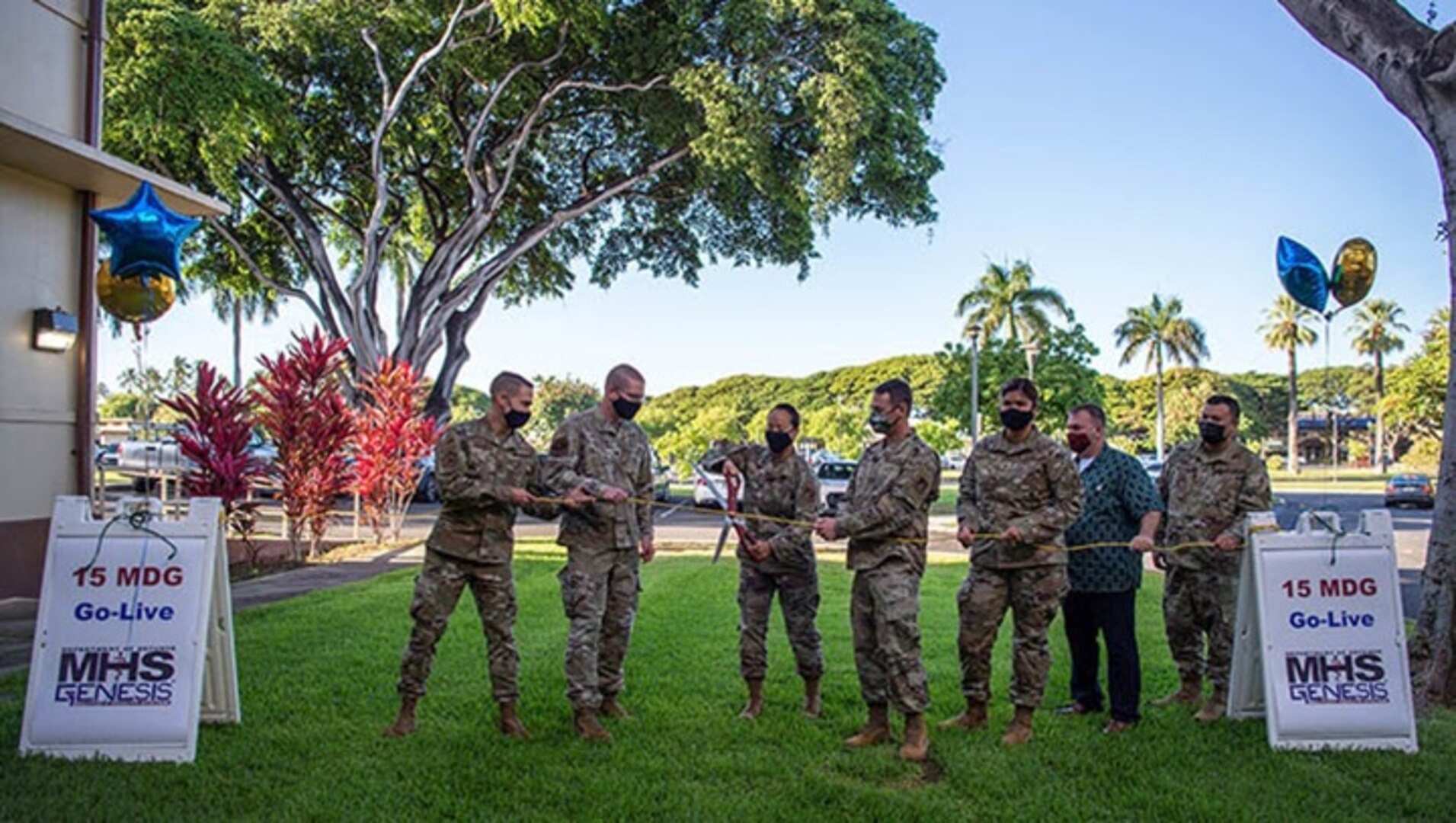 Air Force Col. Stephanie Ku, 15th Medical Group commander, cuts a cord with 15th MDG members and MHS GENESIS project integrators during the system’s launch ceremony at Joint Base Pearl Harbor-Hickam, Hawaii, in September (Photo by: Air Force Senior Airman Alan Ricker)