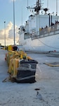 Narcotics, interdicted by the crew of U.S. Coast Guard Cutter Legare, lie next to the ship at Coast Guard Base Miami Beach in Miami Beach, Florida, Oct. 15, 2021. The vessel's crew conducted an eight-week counter-narcotics patrol in the Eastern Pacific in support of Joint Interagency Task Force South and the Coast Guard 11th District. (U.S Coast Guard photo by Chief Petty Officer Charly Tautfest)