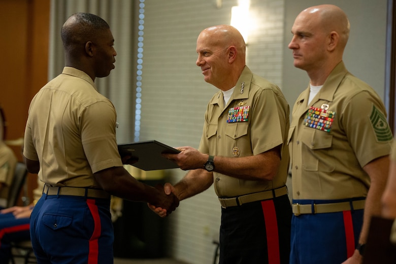 Commandant of the Marine Corps, General David H. Berger, and Sergeant Major of the Marine Corps, Sgt. Maj. Troy E. Black, address Marine Corps Recruiting Command leaders at the command’s National Operations and Training Symposium held in San Antonio, Texas, Oct. 20. In addition to discussing the current state of the Corps and the Commandant’s vision for Force Design 2030, Gen. Berger and Sgt. Maj. Black assisted MCRC leadership with presenting Superior Achiever Awards to top performing Recruiting Station Commanders. Superior Achiever awards are presented annually to recognize outstanding leadership, which directly impact recruiting mission success. (U.S. Marine Corps photo by Lance Cpl. Jennifer Sanchez)