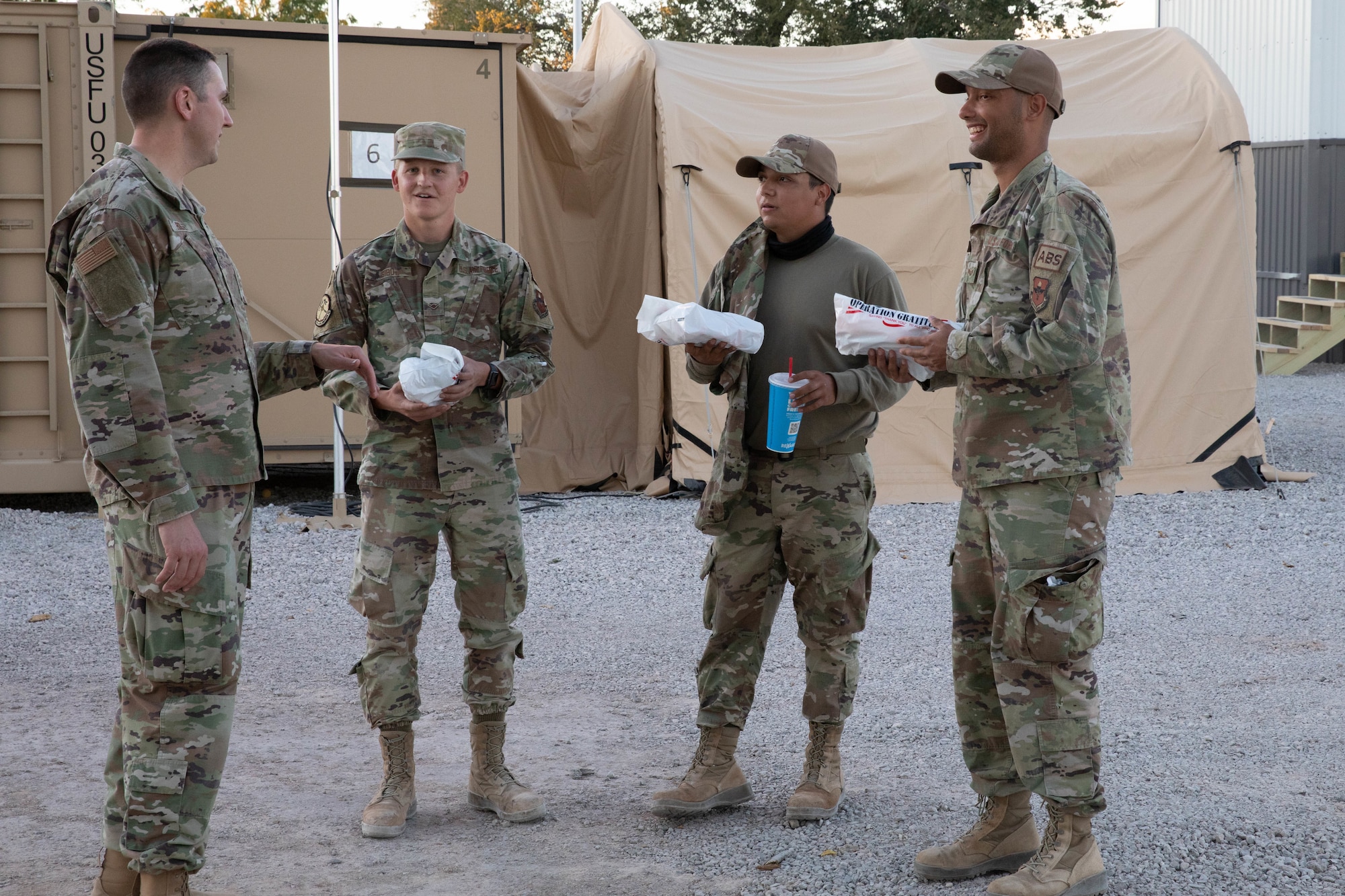 U.S. Air Force Airmen assigned to Task Force Holloman receive care packages from Operation Gratitude, as a thanks for their hard work on Holloman Air Force Base, New Mexico, Oct. 19, 2021. The Department of Defense, through U.S. Northern Command, and in support of the Department of Homeland Security, is providing transportation, temporary housing, medical screening, and general support for at least 50,000 Afghan evacuees at suitable facilities, in permanent or temporary structures, as quickly as possible. This initiative provides Afghan personnel essential support at secure locations outside Afghanistan. (U.S. Army Photo By Pfc. Anthony Ford)