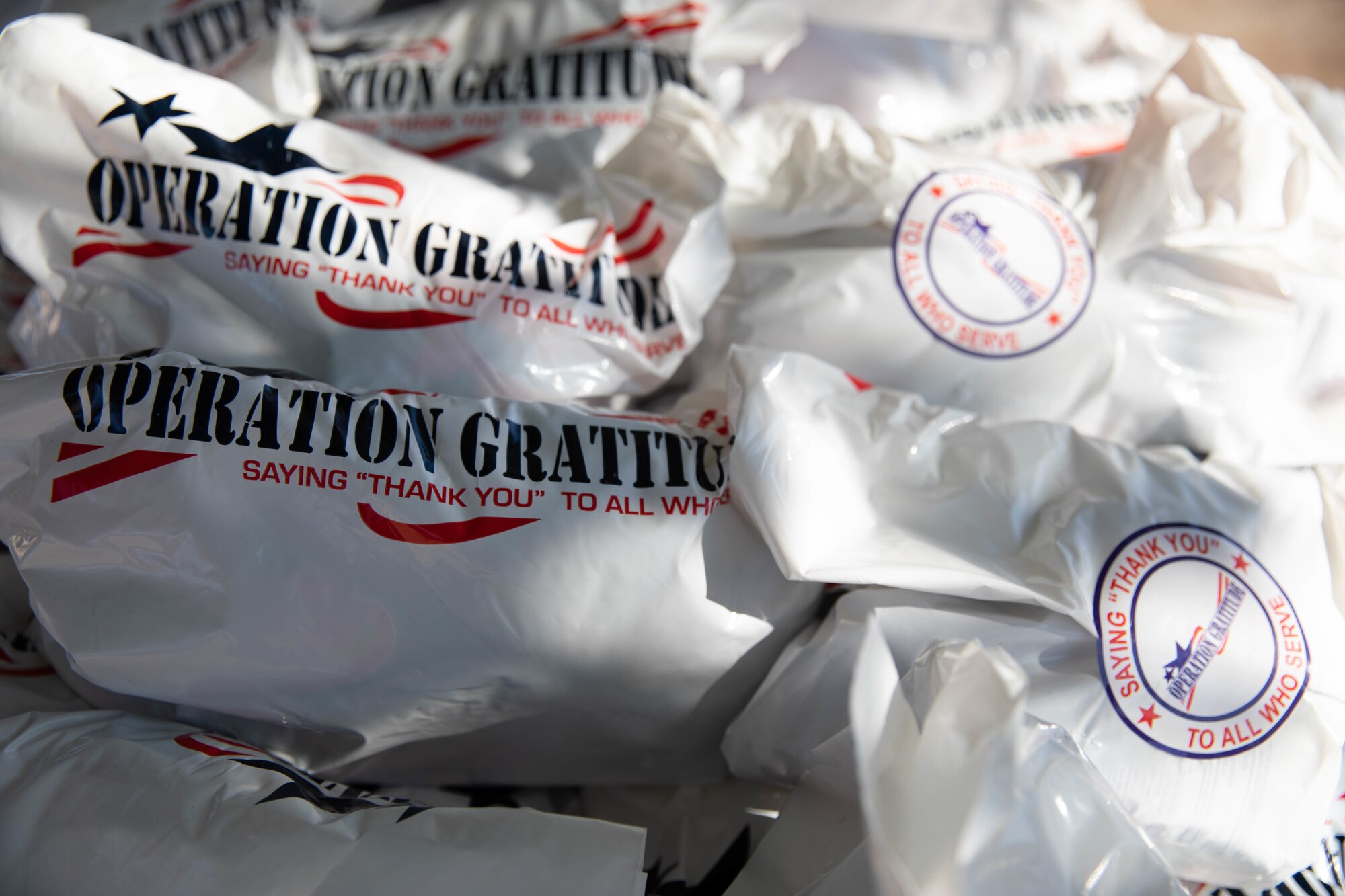 U.S. Air Force Airmen assigned to Task Force Holloman receive hundreds of care packages from Operation Gratitude, as a thanks for their hard work on Holloman Air Force Base, New Mexico, Oct. 19, 2021. The Department of Defense, through U.S. Northern Command, and in support of the Department of Homeland Security, is providing transportation, temporary housing, medical screening, and general support for at least 50,000 Afghan evacuees at suitable facilities, in permanent or temporary structures, as quickly as possible. This initiative provides Afghan personnel essential support at secure locations outside Afghanistan. (U.S. Army Photo By Pfc. Anthony Ford)