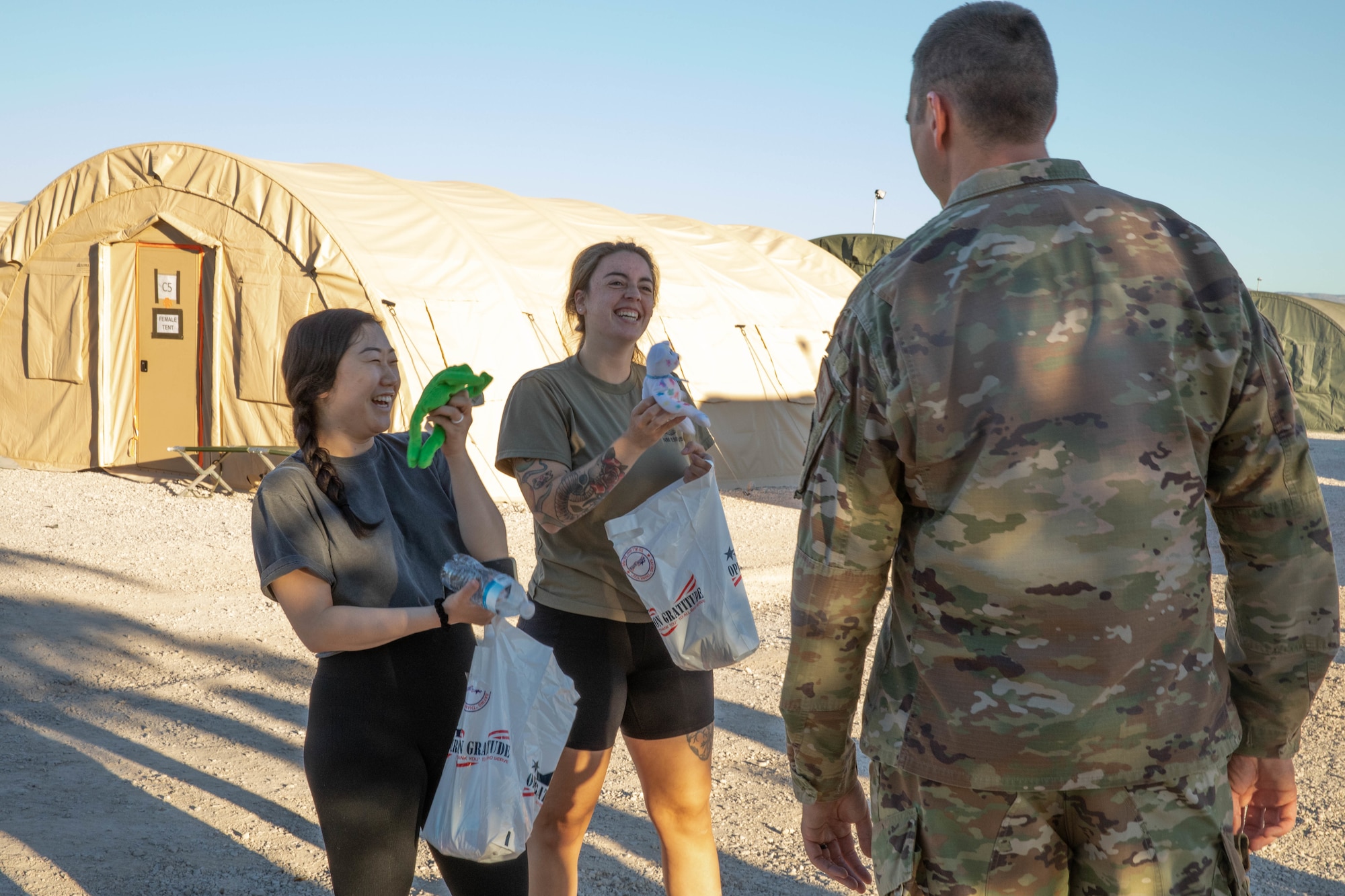 U.S. Air Force Airmen assigned to Task Force Holloman receive care packages from Operation Gratitude, as a thanks for their hard work on Holloman Air Force Base, New Mexico, Oct. 19, 2021. The Department of Defense, through U.S. Northern Command, and in support of the Department of Homeland Security, is providing transportation, temporary housing, medical screening, and general support for at least 50,000 Afghan evacuees at suitable facilities, in permanent or temporary structures, as quickly as possible. This initiative provides Afghan personnel essential support at secure locations outside Afghanistan. (U.S. Army Photo By Pfc. Anthony Ford)