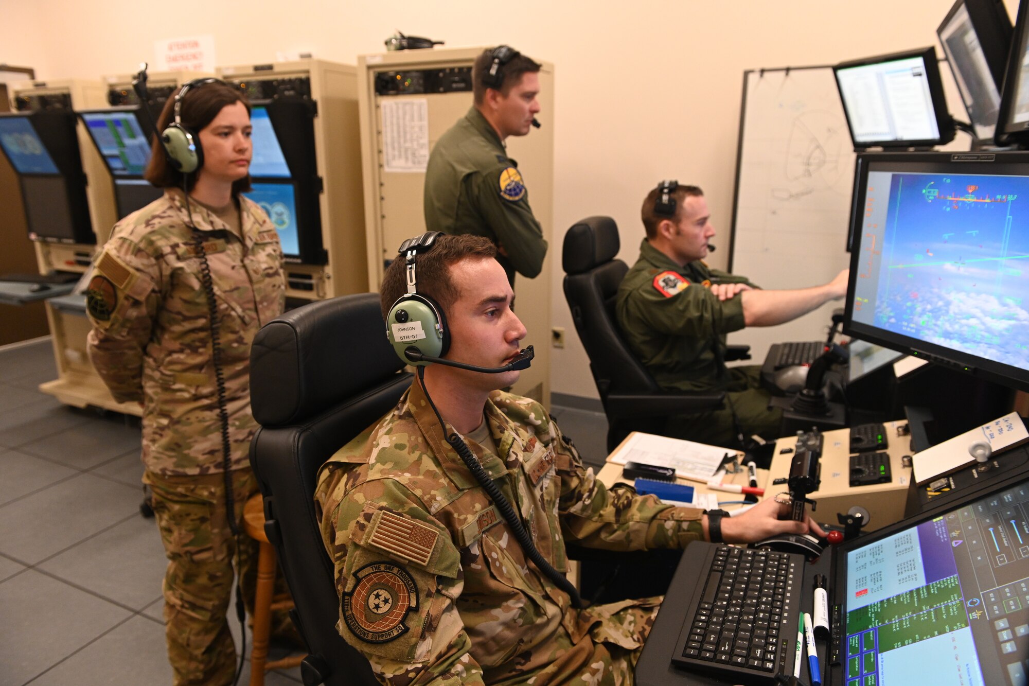 MQ-9 Reaper instructor pilots, assigned to the 491st Attack Squadron, conduct a MQ-9 flight simulation training, July 14, 2021, on Hancock Field Air National Guard Base, New York. The 491st ATKS is a geographically separated unit attached to the 49th Operations Group on Holloman Air Force Base, New Mexico. (U.S. Air Force photo by Staff Sgt. Christopher Sparks)