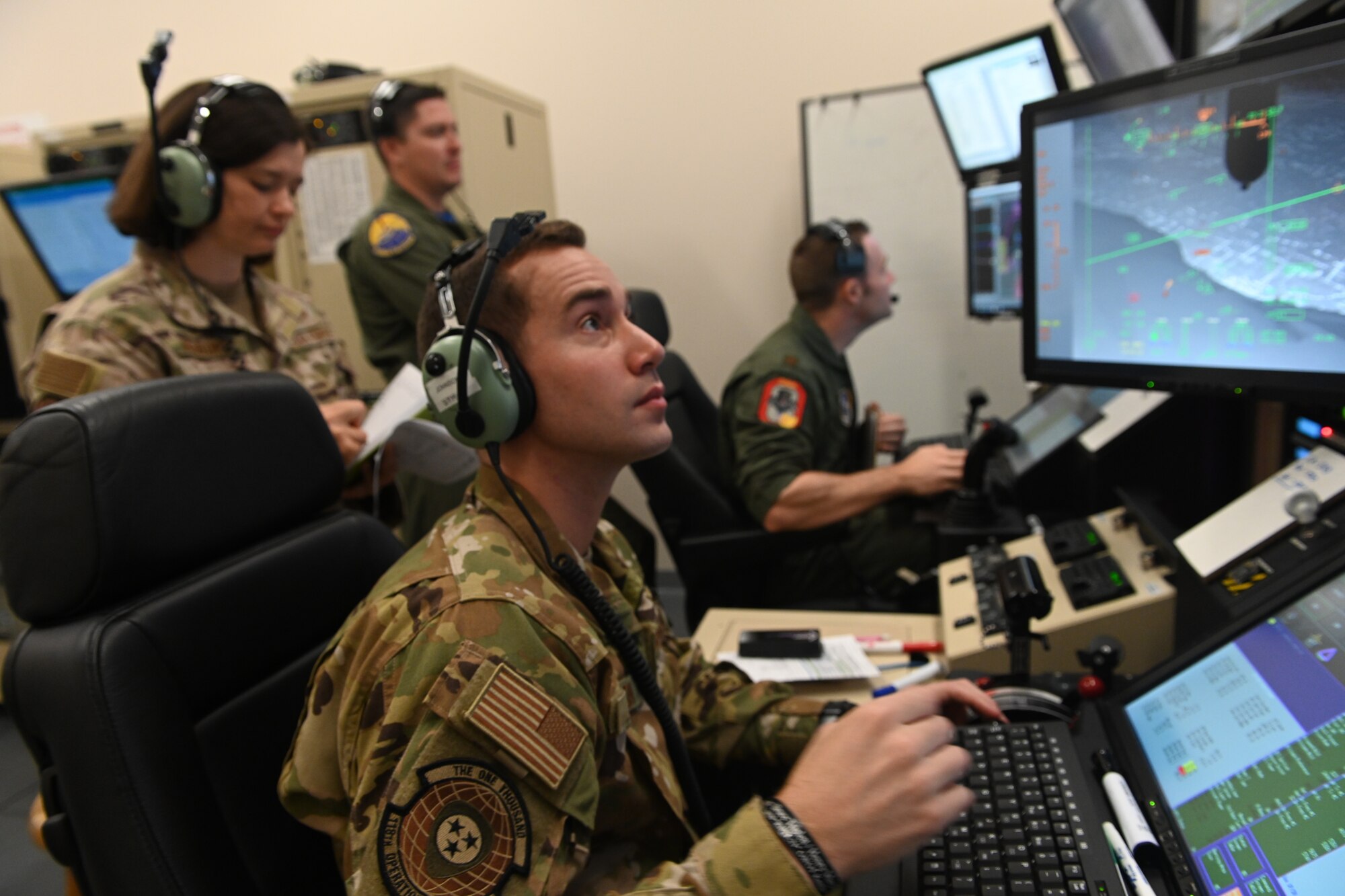 Instructor pilots, assigned to the 491st Attack Squadron, conduct a MQ-9 Reaper flight simulation training, July 14, 2021, on Hancock Field Air National Guard Base, New York. Students at the 491st ATKS participate in various real-world simulations to emulate situations they may find in operational environments. (U.S. Air Force photo by Staff Sgt. Christopher Sparks)