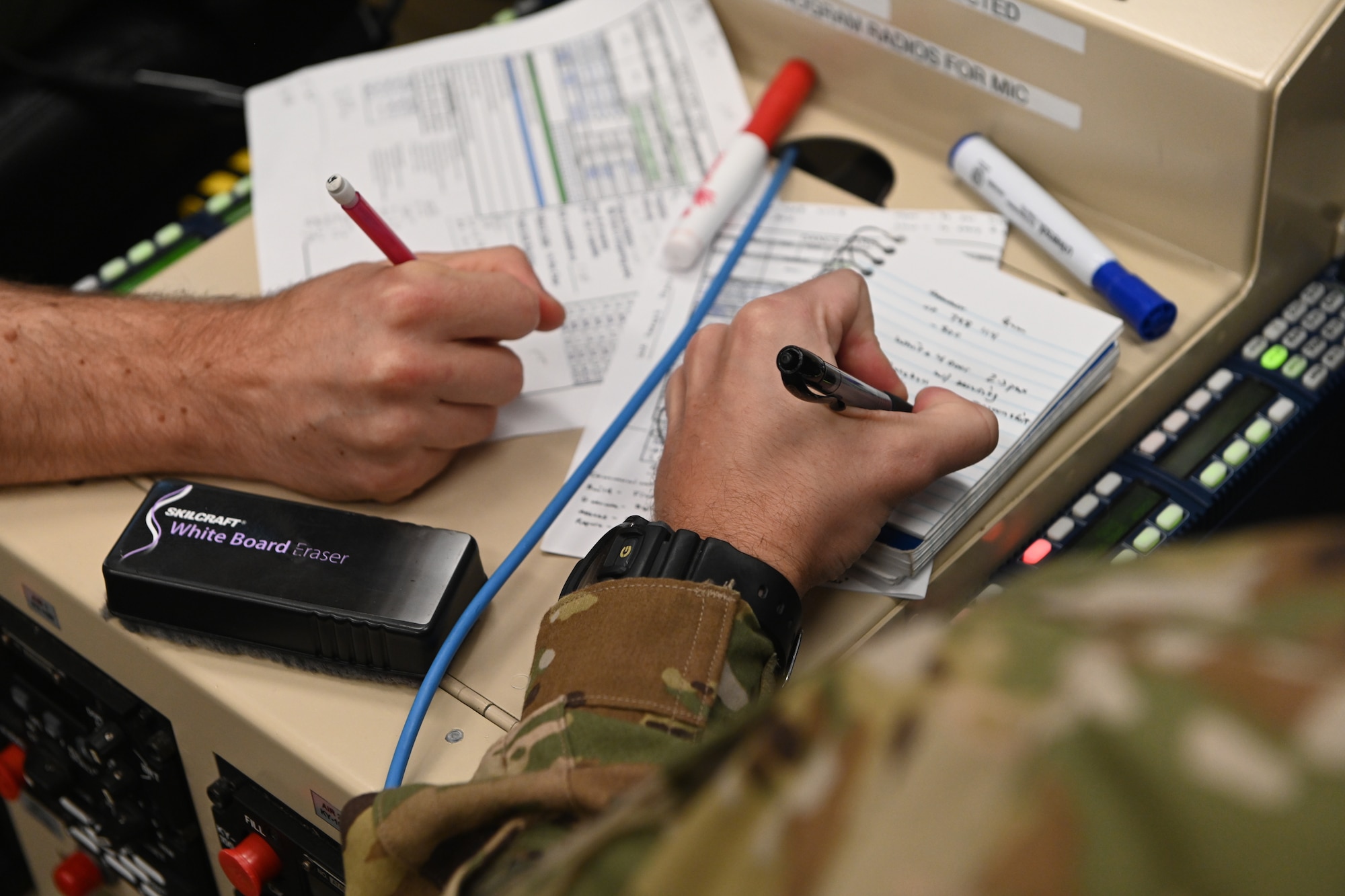 A MQ-9 Reaper student pilot and sensor operator student, assigned to the 491st Attack Squadron, participate in a MQ-9 flight simulation training, July 14, 2021, on Hancock Field Air National Guard Base, New York. Student pilots and sensor operators are required to accomplish and demonstrate skill proficiency in multiple flight simulations throughout their formal training courses. (U.S. Air Force photo by Staff Sgt. Christopher Sparks)