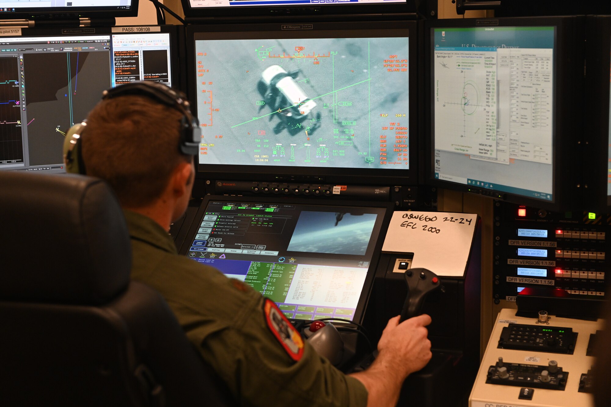 A MQ-9 Reaper student pilot, assigned to the 491st Attack Squadron, locks onto a simulated target during a flight simulation training, July 14, 2021, on Hancock Field Air National Guard Base, New York. During flight simulations, instructor pilots work with their students to ensure proper protocols and techniques are utilized in various situations. (U.S. Air Force photo by Staff Sgt. Christopher Sparks)