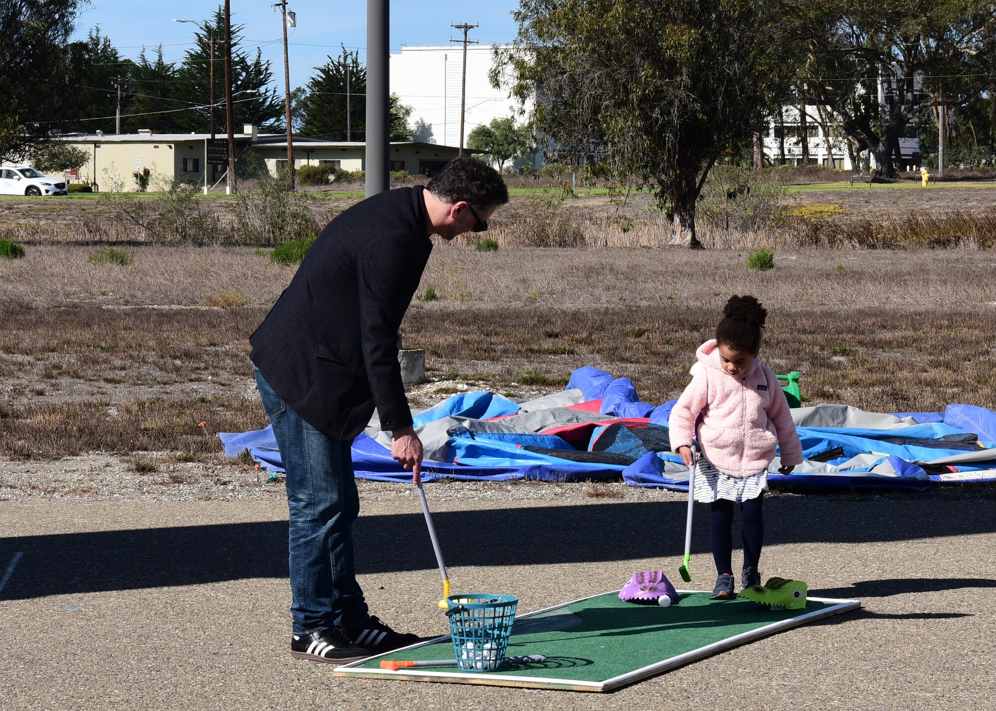 Families enjoyed mini golf and many other activities during Vandenberg’s Ninth Annual Exotic Car Show Oct. 23, 2021, at Vandenberg Space Force Base, Calif. Other activities including corn hole, wall climbing and an inflatable obstacle course were available for members and their families to enjoy at the car show. (U.S. Space Force photo by Airman First Class Tiarra Sibley)
