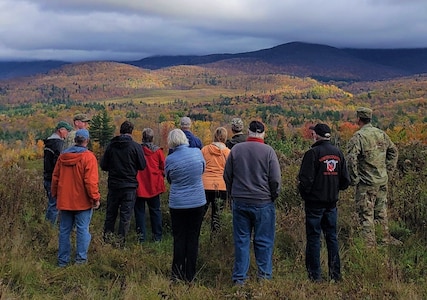 Tour participants observe a high-angle range used by snipers and U.S. Army Mountain Warfare School students to train on engaging targets at distance from an elevated position at Camp Ethan Allen Training Site, Oct. 22, 2021. Military retirees and neighbors of the range, among others, participated in a public tour of CEATS where they received an overview of range operations and visited military barracks; construction of a new Army Mountain Warfare School; weapon ranges; and the biathlon program. (U.S. Army photo by Maj. J. Scott Detweiler)