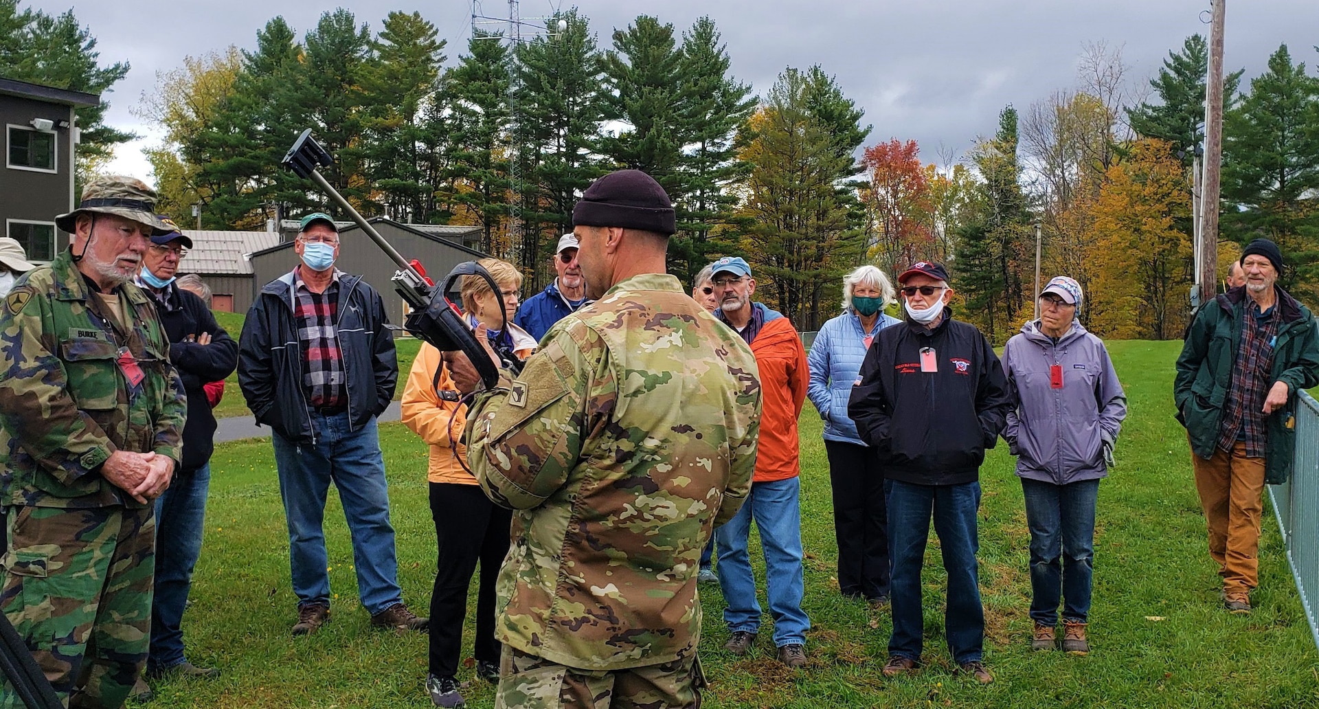 Master Sgt. Daniel Westover, coach, National Guard Biathlon Program, describes the rifle used by biathletes in competition at Camp Ethan Allen Training Site, Oct. 22, 2021. Military retirees and neighbors of the range, among others, participated in a public tour of CEATS where they received an overview of range operations and visited military barracks; construction of a new Army Mountain Warfare School; weapon ranges; and the biathlon program. (U.S. Army photo by Maj. J. Scott Detweiler)