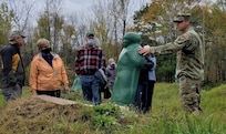 1st Sgt. Anthony Fletcher, training site command, Garrison Support Command, demonstrates how targets work on a pistol range at Camp Ethan Allen Training Site, Oct. 22, 2021. Military retirees and neighbors of the range, among others, participated in a public tour of CEATS where they received an overview of range operations and visited military barracks; construction of a new Army Mountain Warfare School; weapon ranges; and the biathlon program. (U.S. Army photo by Maj. J. Scott Detweiler)