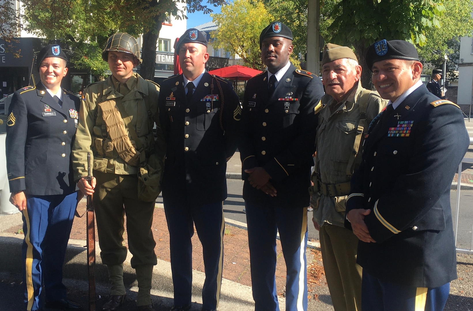 (l-r)  Staff Sgt. Amy Carroll, French WWII reenactor, Staff Sgt. Corey Clemens, Sgt. Prince Murphy, French WWII reenactor and Capt. Jesse Hernandez pose for a photo at the monument dedication ceremony in Epinal, France, Sept. 25. (photo provided by Lt. Col. Shane Riley, 45th Infantry Brigade Combat Team)