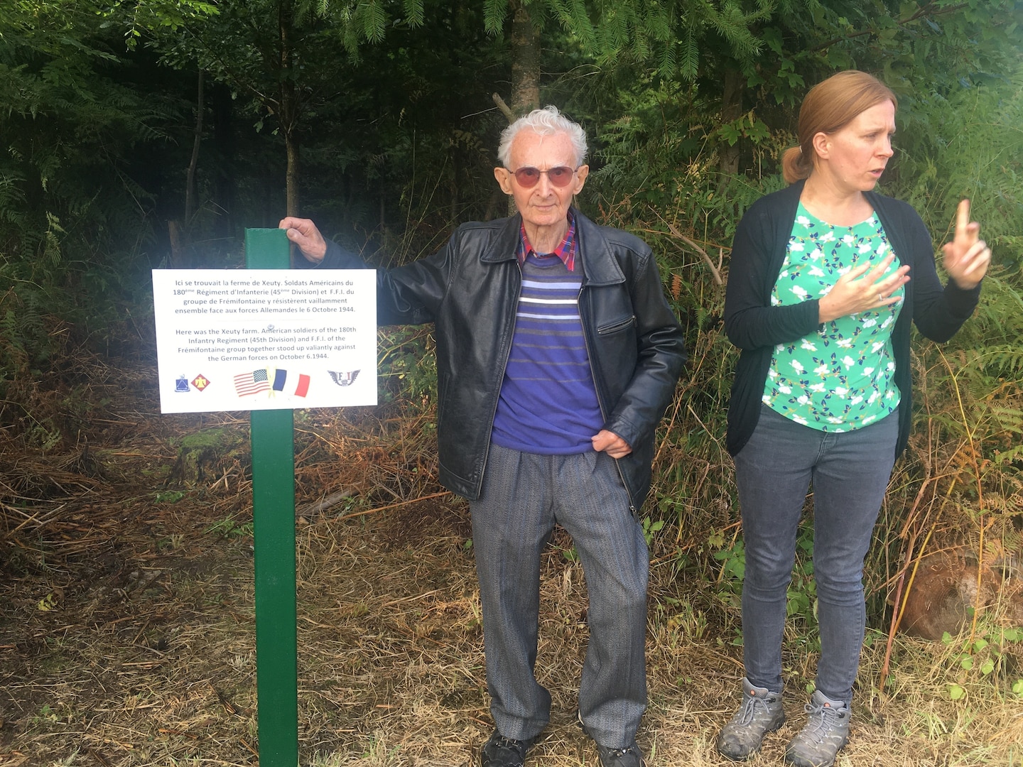 Marcel Demangen, a 96-year-old French resistance veteran poses near where he linked up with American Soldiers from the 45th Infantry Division in 1944.

Marcel was a member of the French Resistance that linked up with a company of the 180th Infantry Regiment at this spot on October 6, 1944. The company along with several resistance fighters were encircled by a Nazi regiment and captured. Marcel escaped capture as the youngest member of the party, and only one other French Resistance fighter survived the Nazi internment camps to return home at war's end. Also pictured is Mrs. Sarah Prunier, an American citizen living in France who served as a translator for the visit. (Photo provided by Lt. Col. Shane Riley, 45th Infantry Brigade Combat Team)