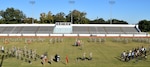 Units of the Fort Benning-based 648th Maneuver Enhancement Brigade render honors during a ceremony at Doughboy Stadium Oct. 23, 2021 to welcome the new command team of Col. Kris Marshall and Command Sgt. Major Rodney Bettis.