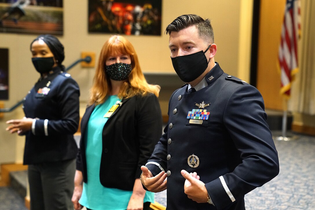 uniformed space force member talks about new uniforms to a crows