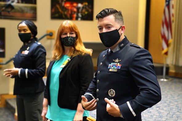 uniformed space force member talks about new uniforms to a crows