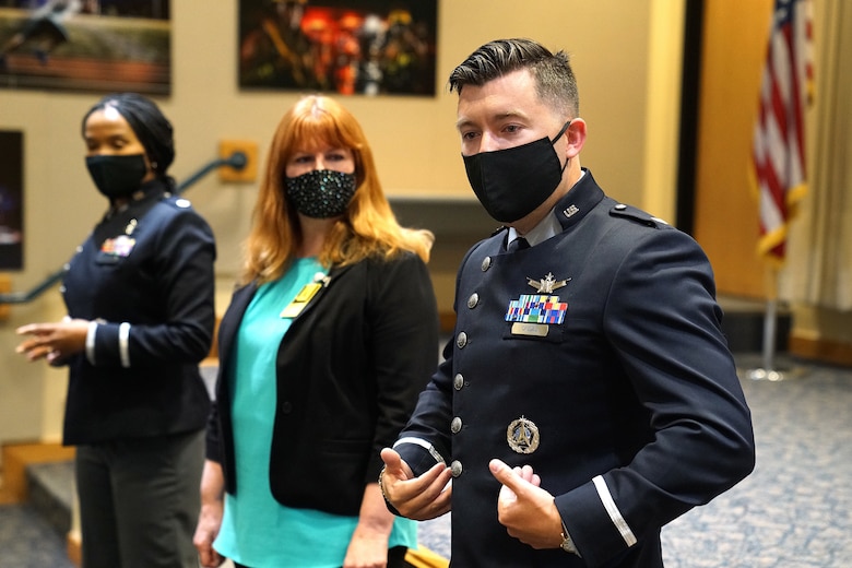 uniformed space force member talks about new uniforms to a crows