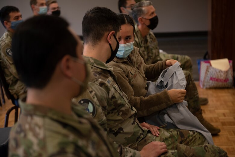 military members check out prototype shirt for the united states space force