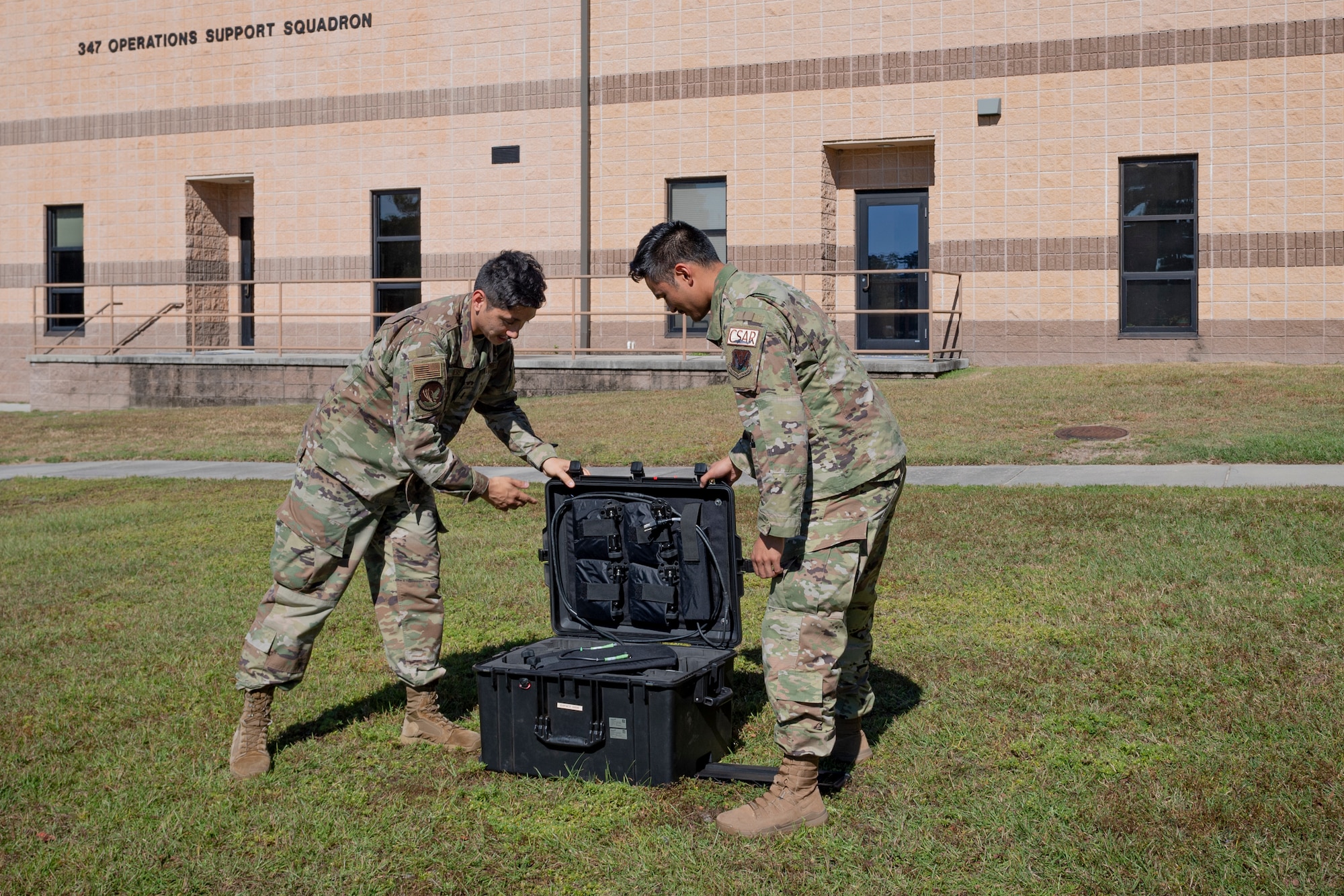 Photo of Airmen preparing to configure a multi-mission terminal