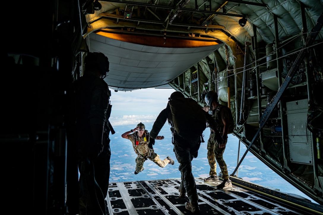 A photo of Airmen jumping from aircraft.