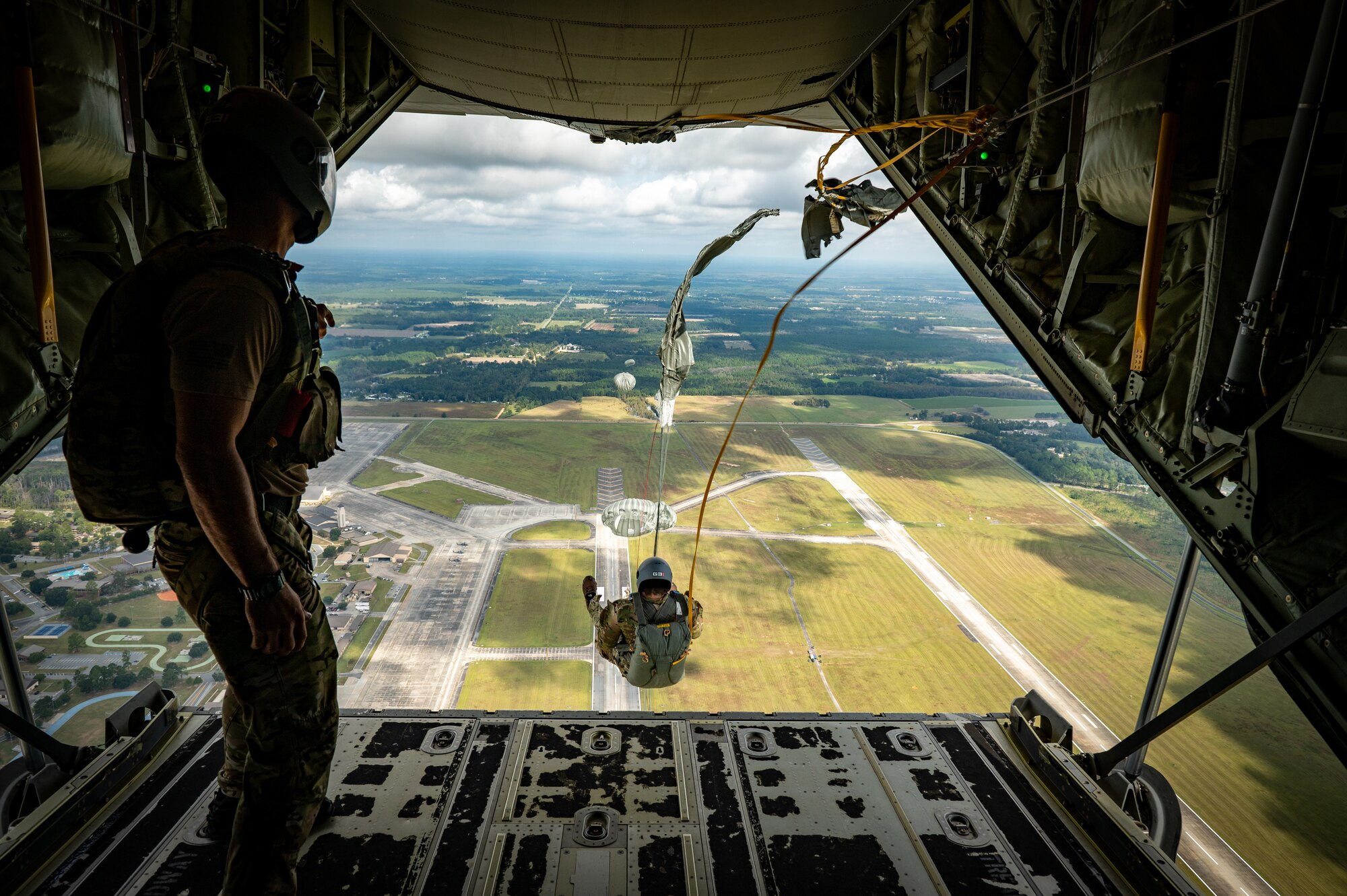 A photo on an Airman jumping.