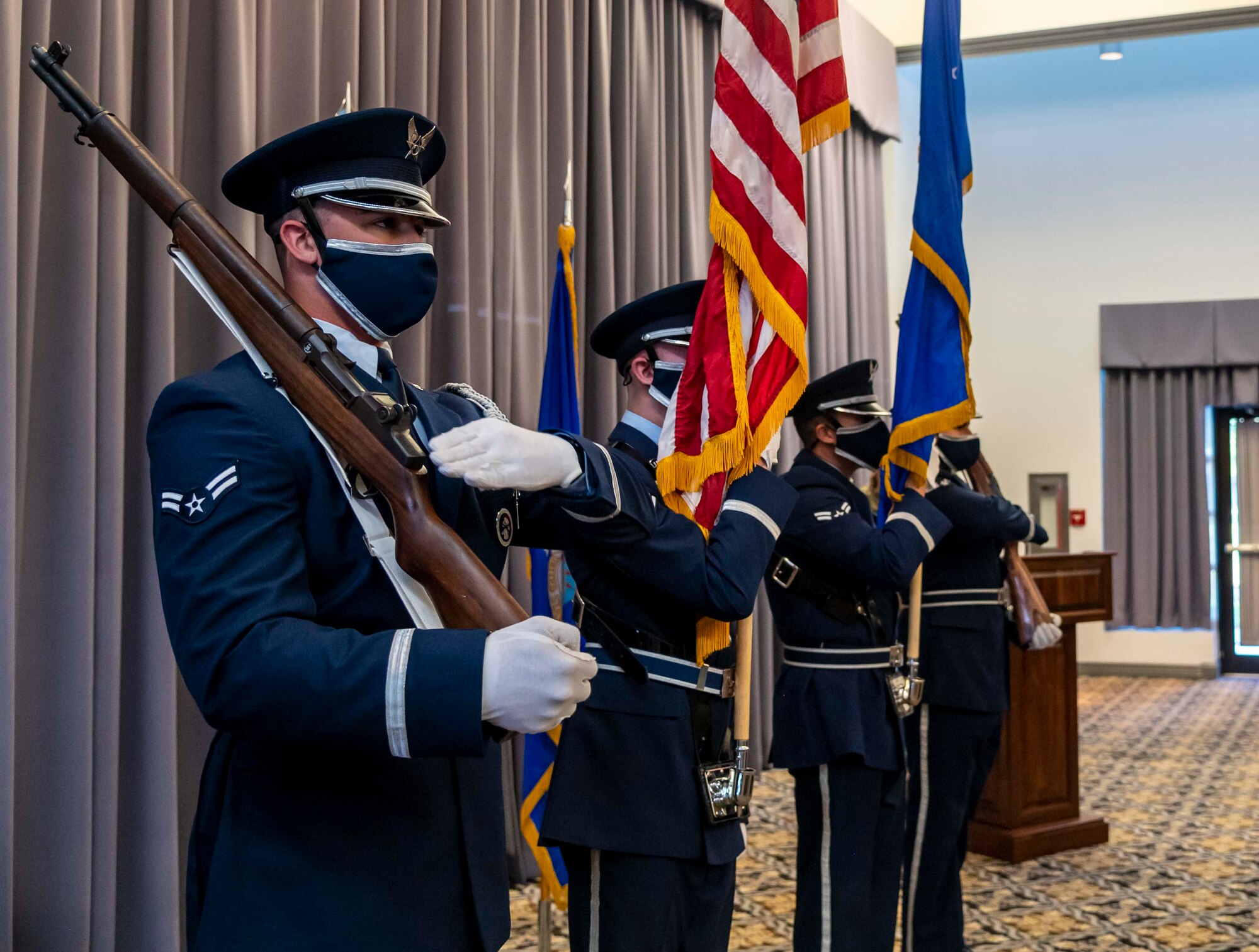 Members of the Dover Air Force Base Honor Guard present the colors during the 2021 Honorary Commander Induction Ceremony Oct. 22, 2021, at Dover AFB, Delaware. Team Dover's HCC program first began in 1992 as a way to match leaders from across the state with commanders from the 436th Airlift Wing, 512th AW, Air Force Mortuary Affairs Operations, Armed Forces Medical Examiner System, Joint Personal Effects Depot and the 373rd Training Squadron, Detachment 3. (U.S. Air Force photo by Senior Airman Stephani Barge)