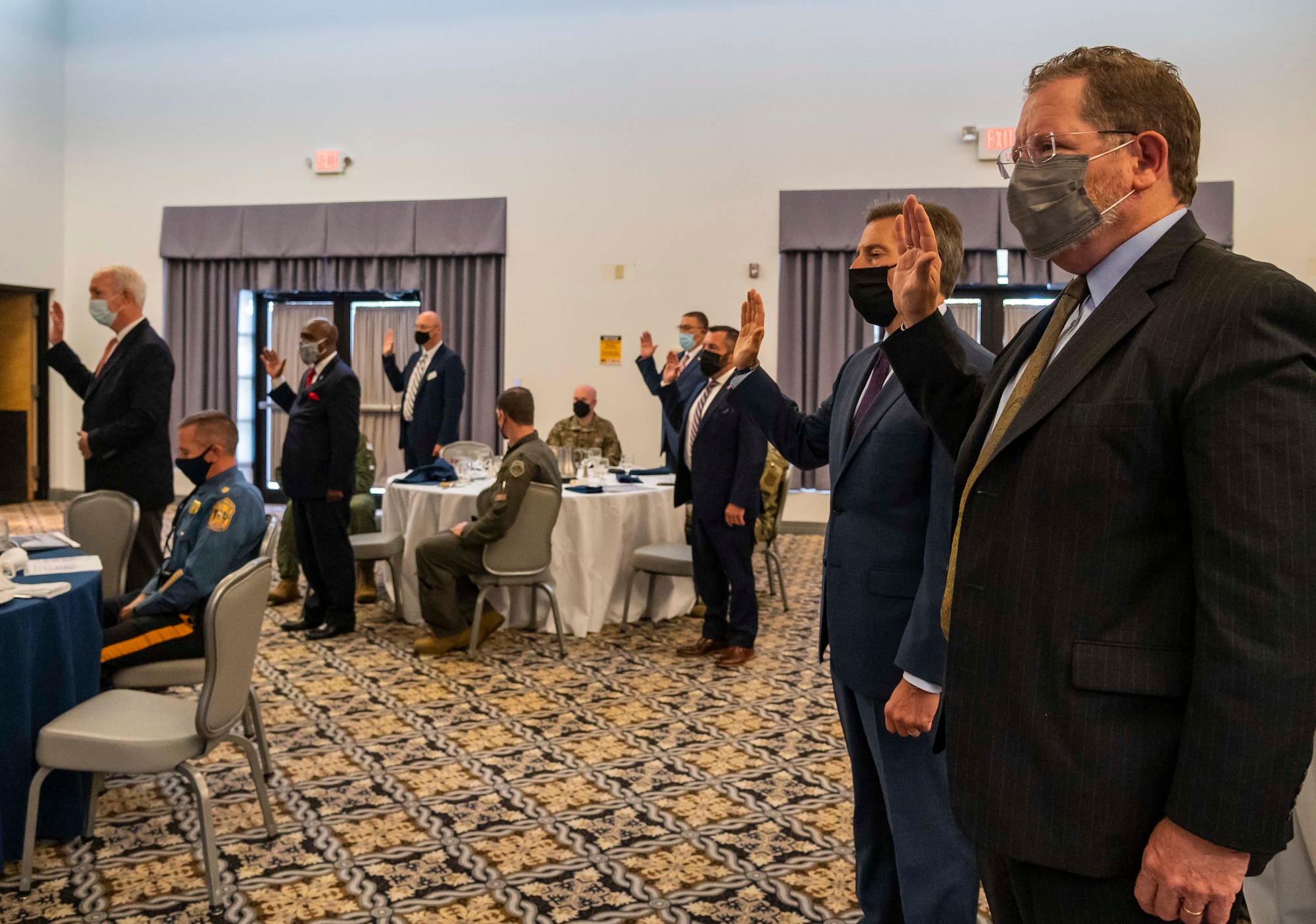 Newly appointed civic leaders recite the Honorary Commander’s Oath during the 2021 HCC Induction Ceremony Oct. 22, 2021, at Dover Air Force Base, Delaware. Thirty-eight local civic and business leaders were inducted into the HCC program. (U.S. Air Force photo by Senior Airman Stephani Barge)