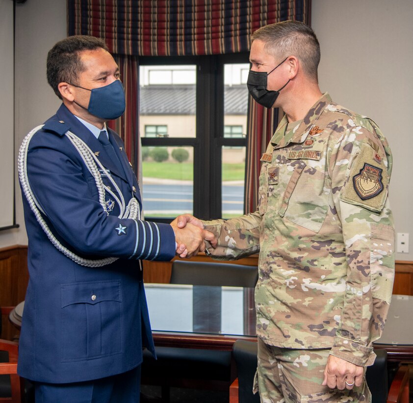 U.S. Air Force Col. Shannon Anderson, right,  436th Airlift Wing vice commander, meets with Chilean Air Force Col. Humberto Fernández, Chilean air attaché and head of mission, at Dover Air Force Base, Delaware, Oct. 26, 2021. Anderson and Fernandez discussed the strategic partnership between the two countries. (U.S. Air Force photo by Tech. Sgt. Nicole Leidholm)