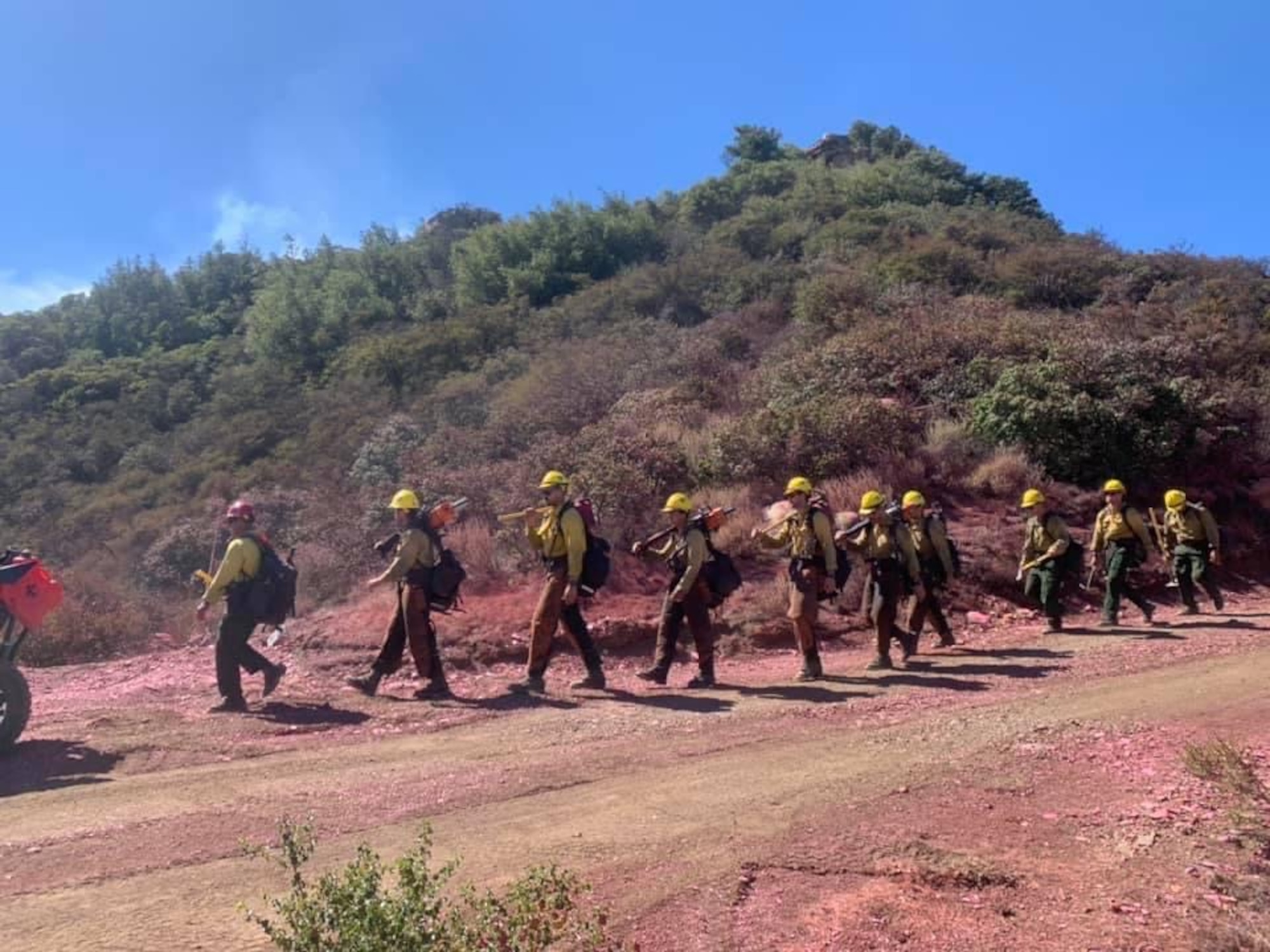 Firefighters assigned to the 30th Civil Engineer Squadron sift the ground to combat the Alisal Fire Oct. 11, 2021, at Los Padres National Forest in Goleta, Calif. Sifting the ground is part of the firefighters training they take at Vandenberg. (Courtesy photo)