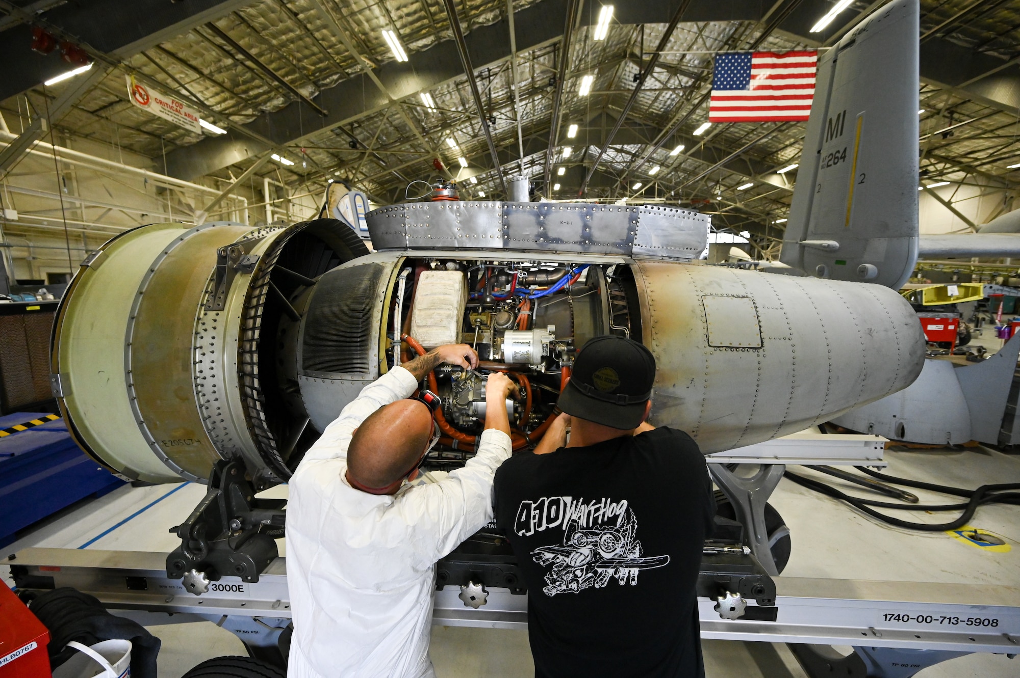 Brent Coffin, left, and Kalen Cole, 571st Aircraft Maintenance Squadron, work on an engine for A-10 Thunderbolt II, tail number 80-0264, at Hill Air Force Base, Utah, Sept. 28, 2021.