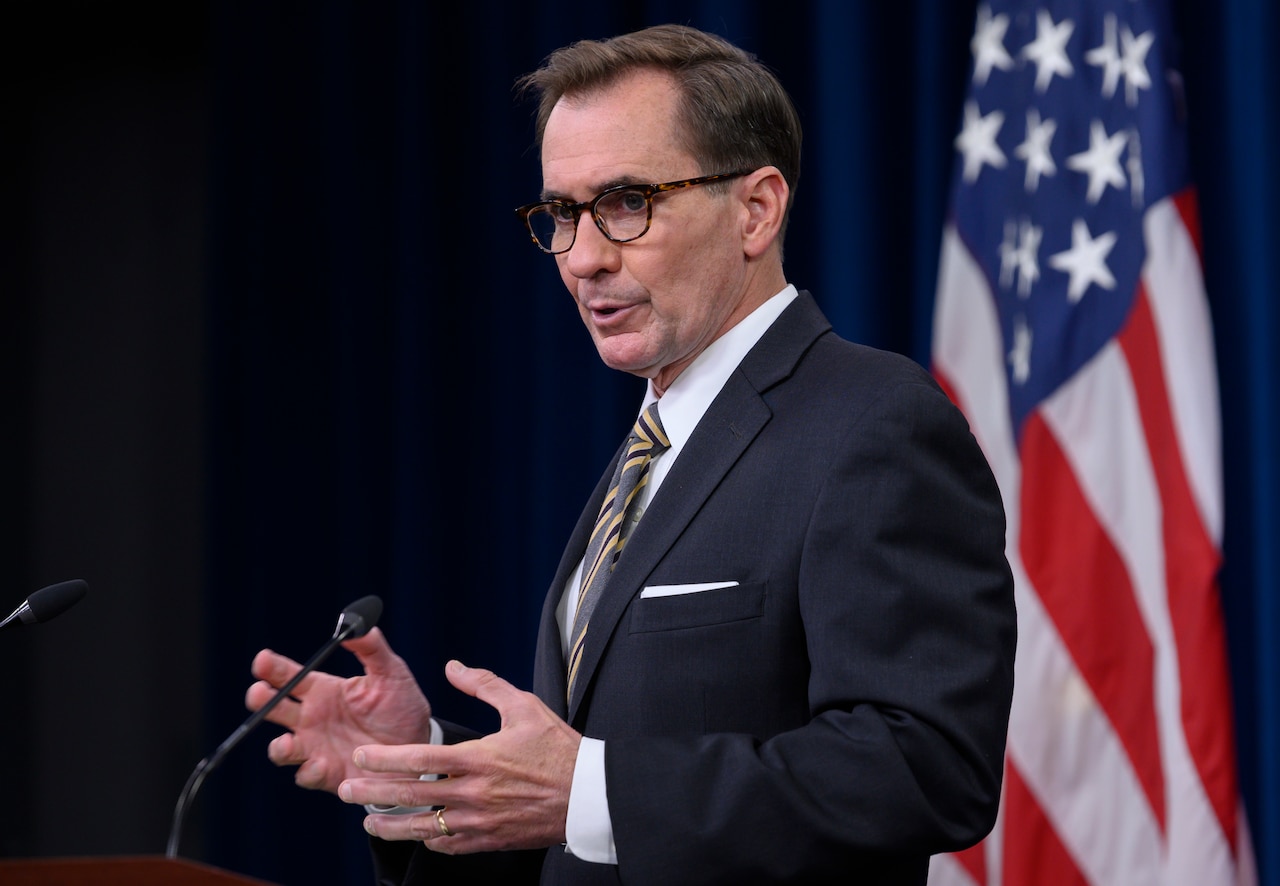 Man speaks at lectern.