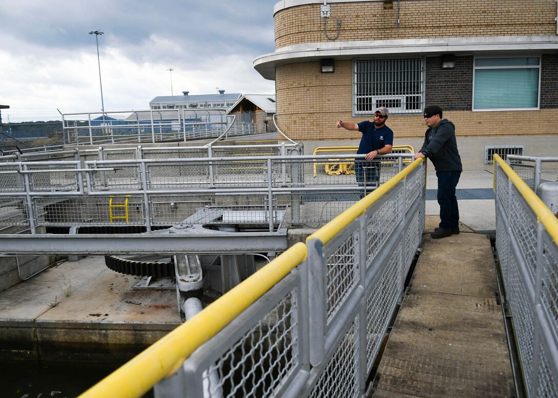 Old Hickory Lock and Dam Equipment Mechanic Supervisor Justin Gray describes to Antioch Middle School science teacher Thomas Yan the lock protocol for allowing vessels through the regulated passageway at the Old Hickory Lock and Dam in Hendersonville, TN.