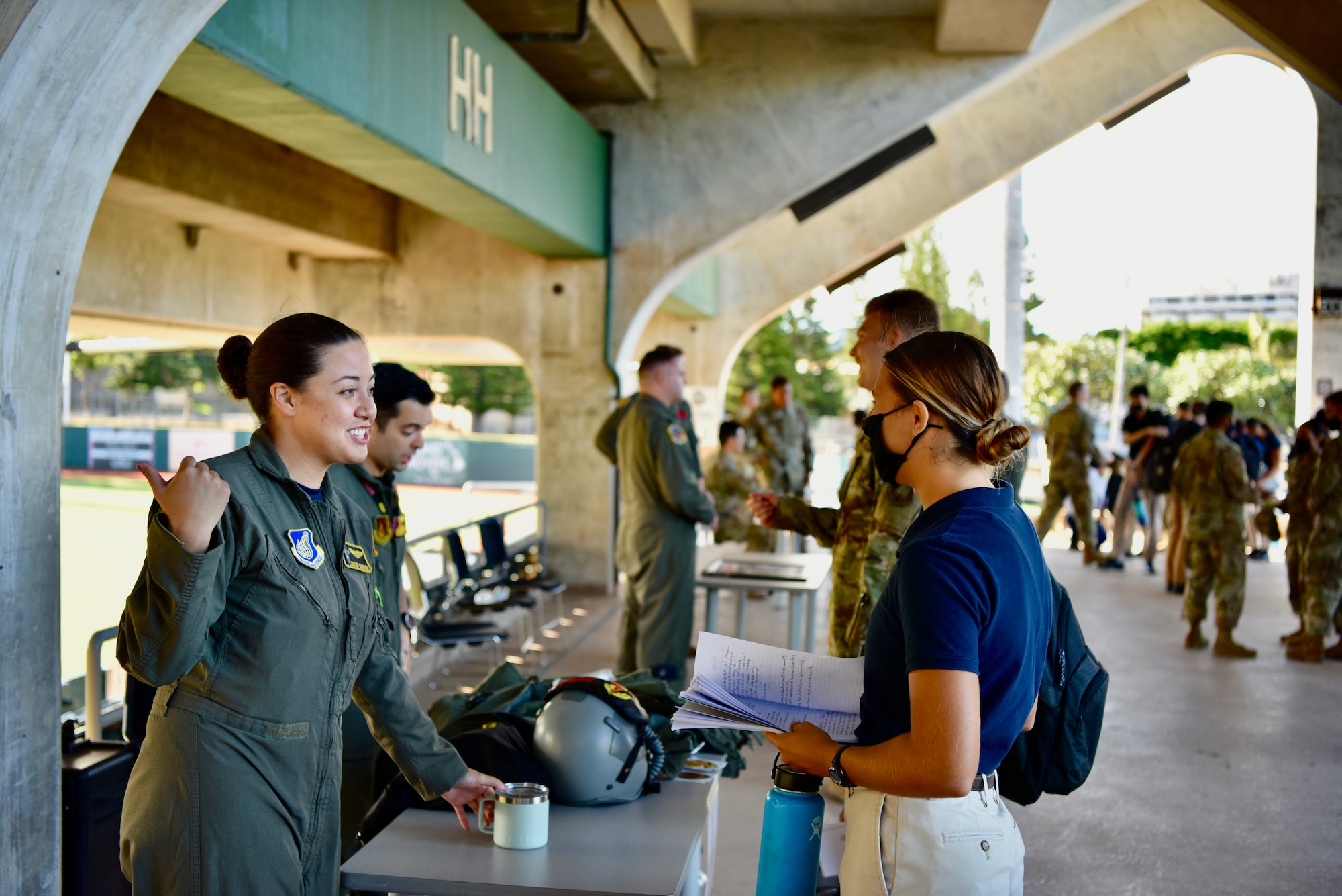 Capt. Skyler Kamaka, 203d Air Refueling Squadron pilot, talks with Air Force Reserve Officer Training Corps Cadet Fourth Class Nicole McGregor, Detachment 175, during career day at the University of Hawaii at Mānoa, Hawaii, Oct. 22, 2021. Air Force officers from across Oahu visited with AFROTC cadets to give them insights to different careers and officer life.  (U.S. Air Force photo by 1st Lt. Benjamin Aronson)
