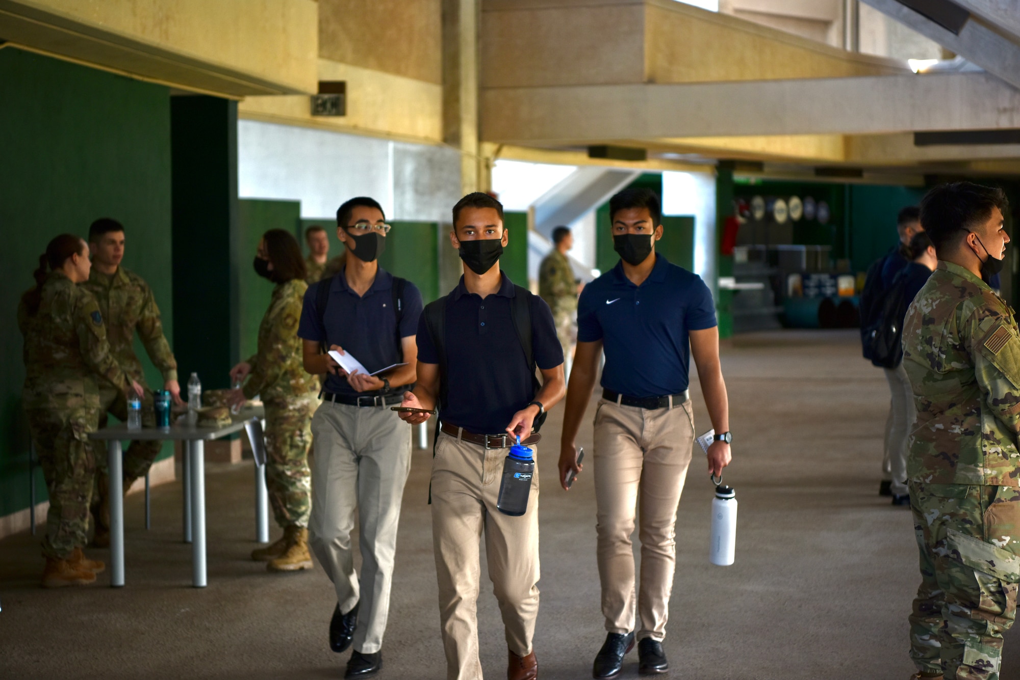 Air Force Reserve Officer Training Corps cadets from Detachment 175 walk through an Air Force officer career day at the University of Hawaii at Mānoa, Hawaii, Oct. 22, 2021. Air Force officers from across Oahu visited with AFROTC cadets to teach them about different careers and officer life. (U.S. Air Force photo by 1st Lt. Benjamin Aronson)