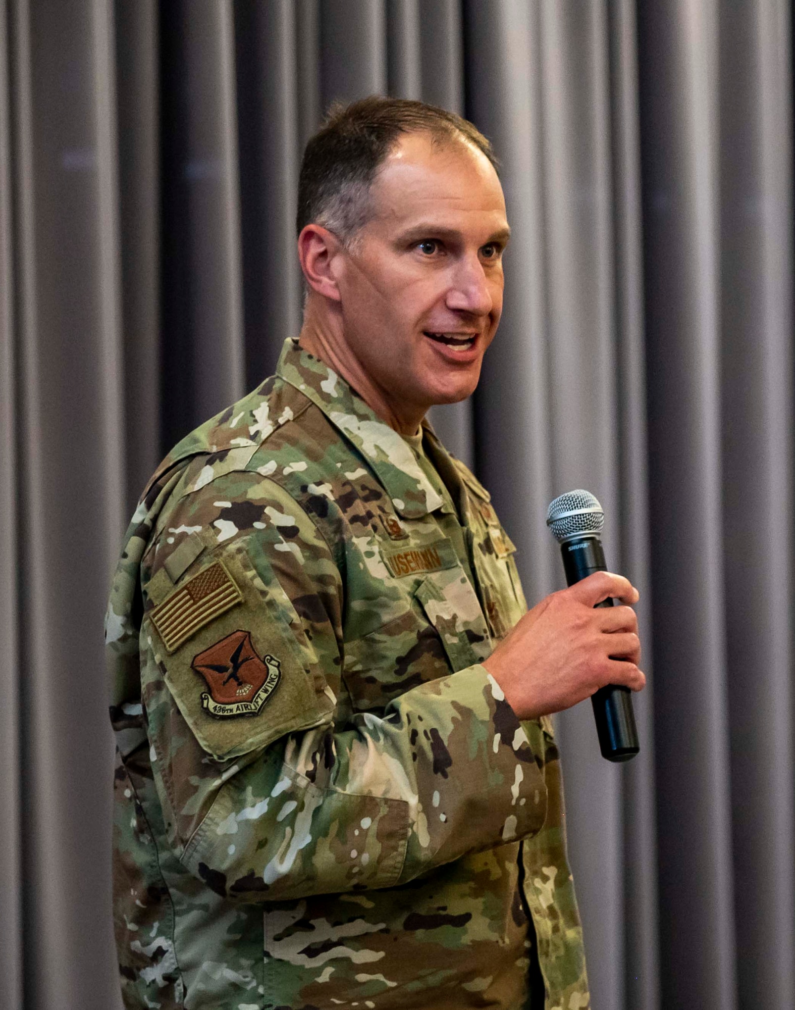 Col. Matt Husemann, 436th Airlift Wing commander, gives opening remarks during the 2021 Honorary Commander Induction Ceremony Oct. 22, 2021, at Dover Air Force Base, Delaware. The HCC program helps members of the community understand the importance of Dover AFB and the Air Force's mission, while allowing military commanders to learn more about the local community. (U.S. Air Force photo by Senior Airman Stephani Barge)