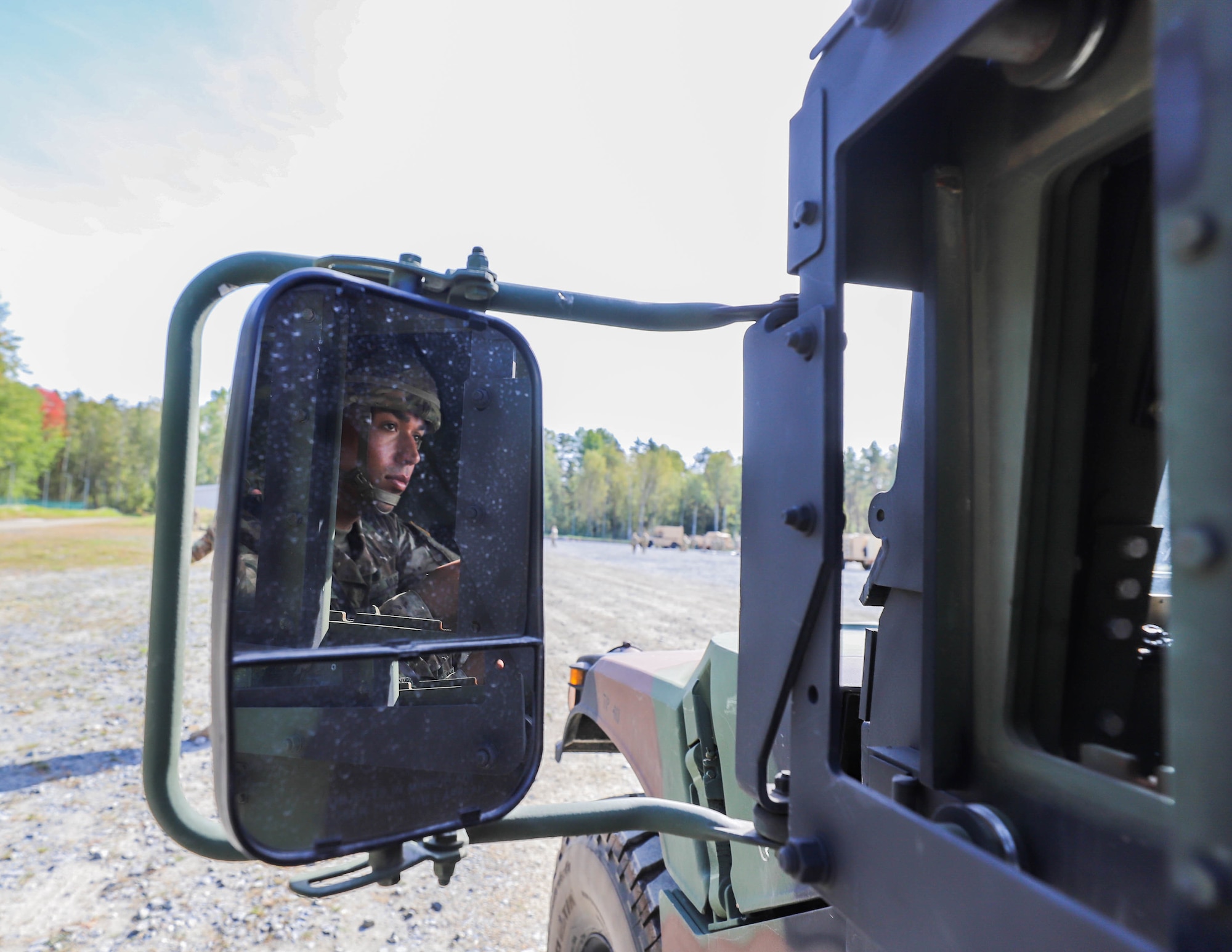photo of U.S. Army Soldier driving a humvee