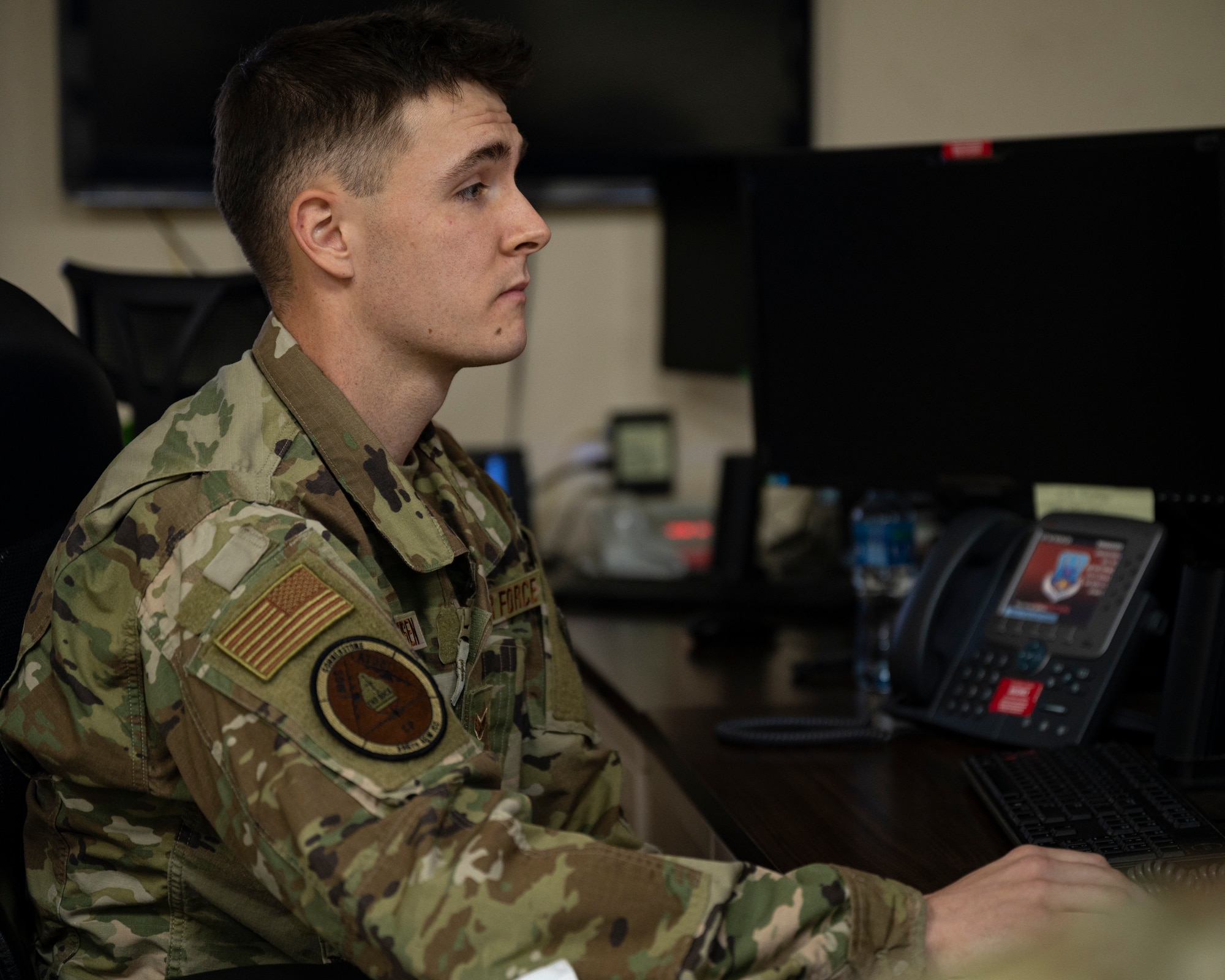 Senior Airman Keith Christensen, 386th Air Expeditionary Wing Command Post controller, monitors activity on computers at Ali Al Salem Air Base, Kuwait, Oct. 21, 2021.