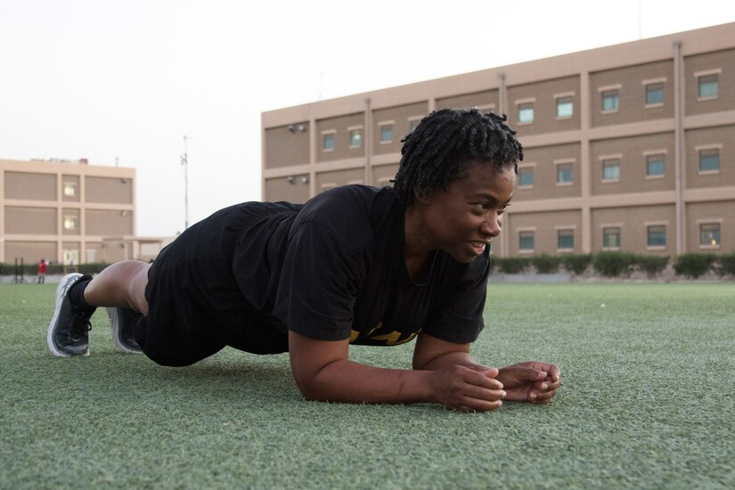 Sgt. 1st Class Christiana U. Charles, a financial management technician deployed with the Kaiserslautern, Germany, based 266th Finance Support Center, completes a plank at Camp Arifjan, Kuwait, on Oct. 23, 2021. The close to 13-year Army veteran said she had a lot of apprehension about the plank, an alternate exercise for the leg tuck in the Army Combat Fitness Test, but faced her fears by training in her barracks room several days a week. Charles can now hold the plank for two minutes, fifteen seconds.
