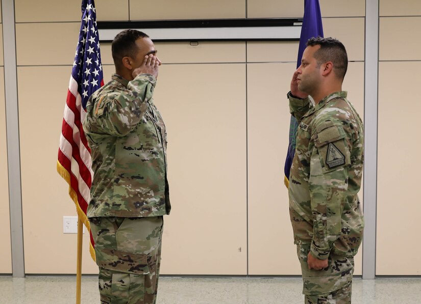 2nd Lt. Orlando Gonzalez receives 1st salute from Master Sgt. Kristofer Serna Sept. 24, 2021, at Bowman Field Armory, during Gonzalez commisioning in ceremony. Gonzalez ended his 16 years of military service as an enlisted service member to begin his officer career.