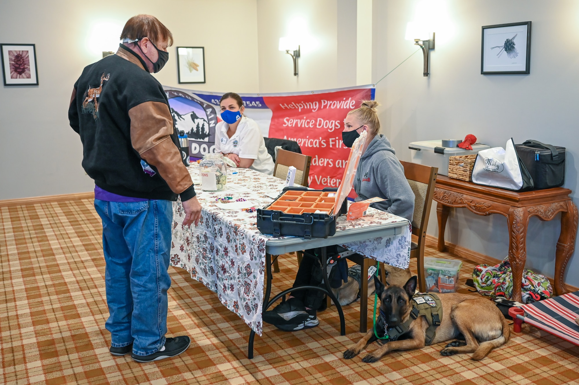 A retiree visits a base information table during Retiree Appreciation Day Oct. 26, 2021, at Hill Air Force Base, Utah. The event gave the base and other agencies an opportunity to voice their gratitude for the dedicated service of the area’s approximately 22,000 military retiree population, and provided information regarding current services, information, resources and benefits. (U.S. Air Force photo by Cynthia Griggs)