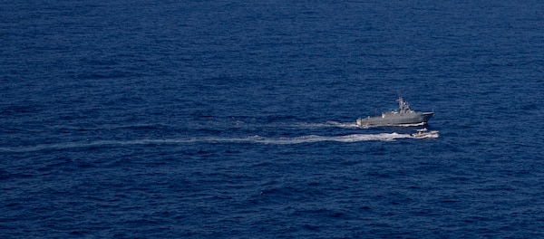 Dominican Republic Navy coast patrol vessel Canopus (CG 107), along a Dominican Republic small boat arrive for a maritime operations exercise with the USS Billings (LCS 15), Oct. 24, 2021.