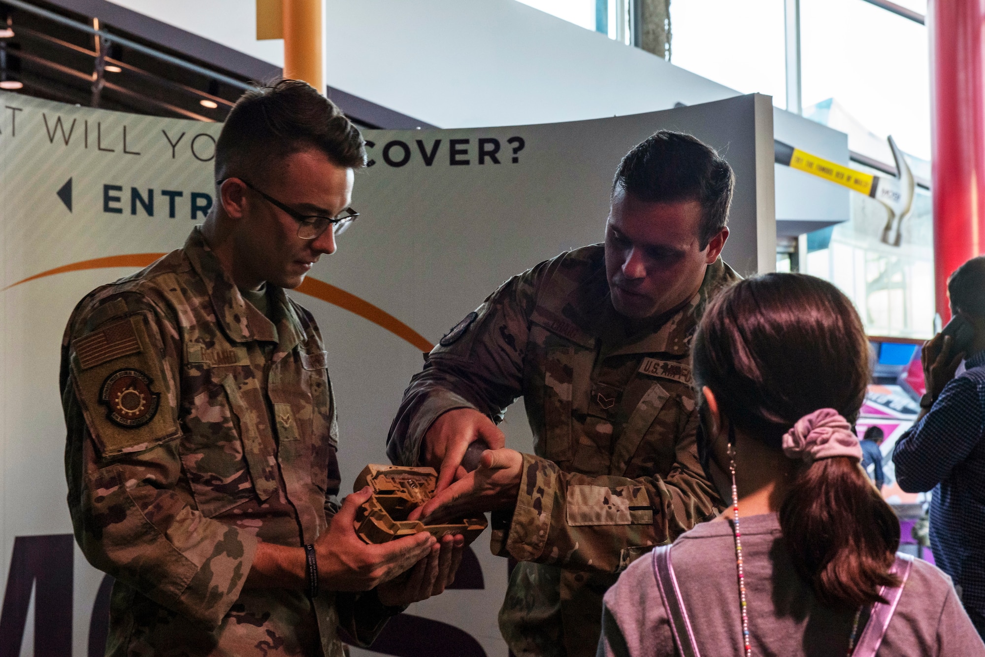 Airman 1st Class Ryker Rowland and Senior Airman Dylan Craig, Explosive Ordnance Disposal Airmen from the 6th Civil Engineer Squadron, display drone capabilities during the STEMtober event at the Museum of Science and Industry in Tampa, Florida, Oct. 21, 2021.
