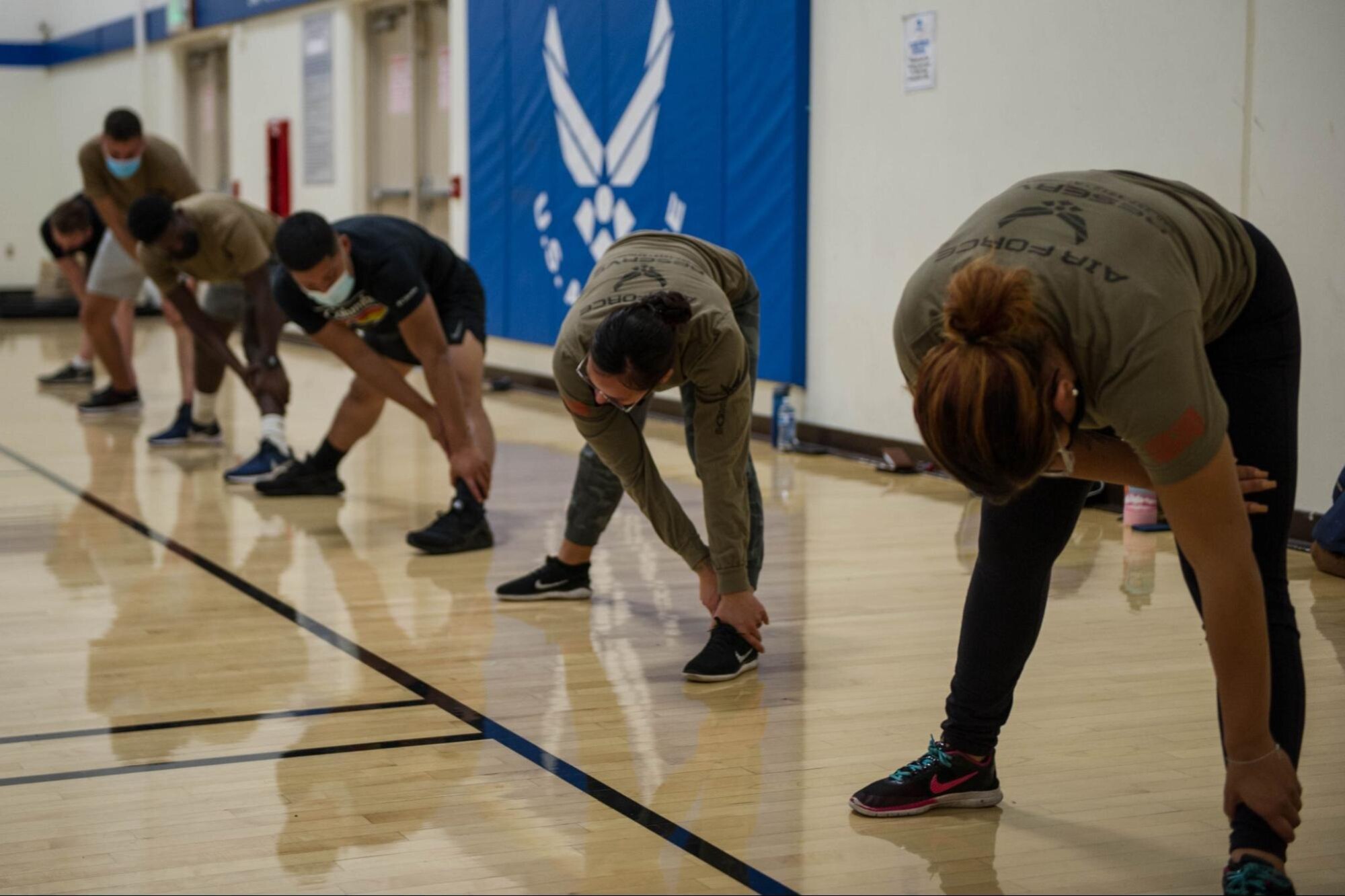 Recruits work out in the gym.