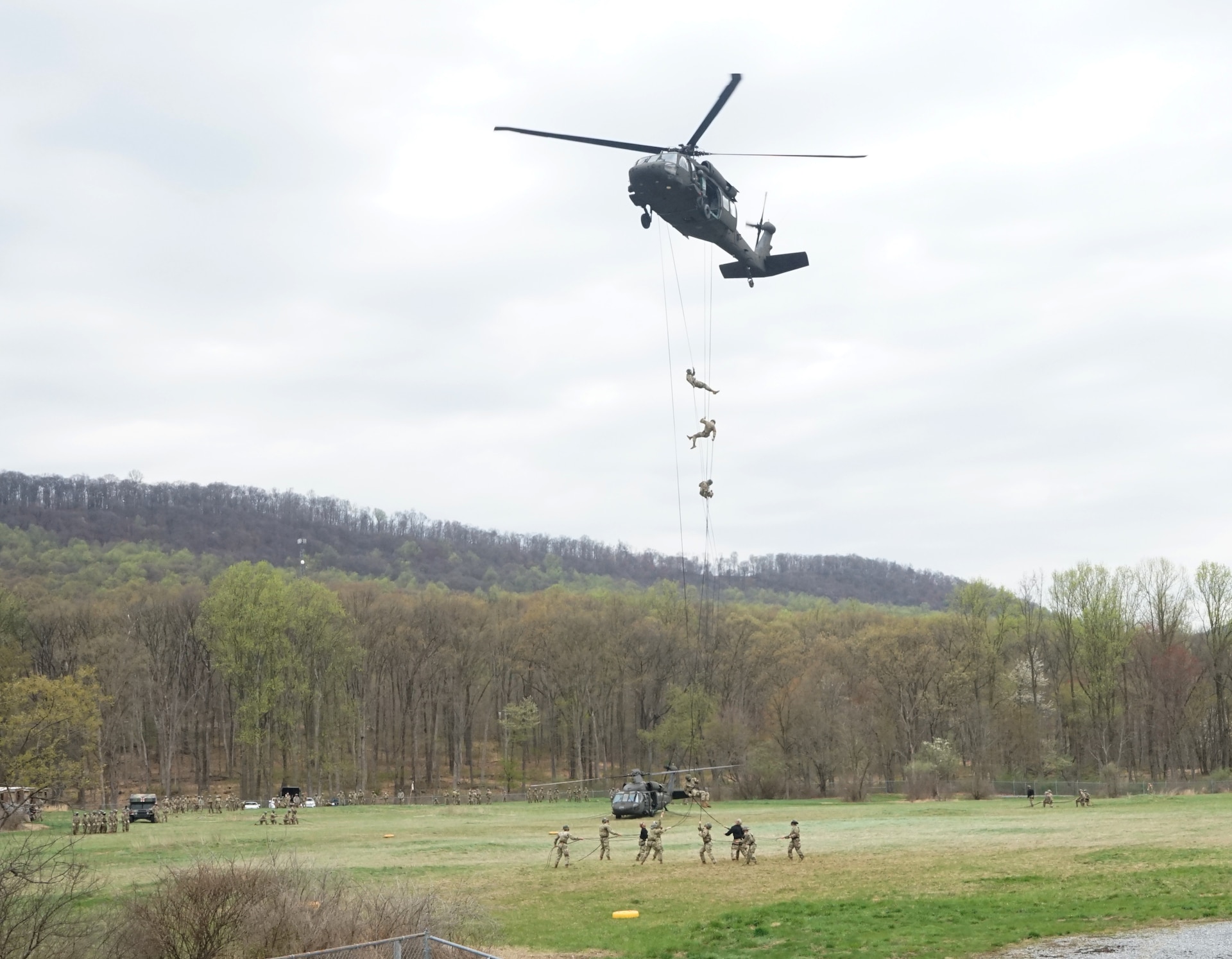 Soldiers rappel from a UH-60 Black Hawk helicopter during Air Assault School at Fort Indiantown Gap on April 15, 2021. Air Assault School is a 10-day course designed to prepare Soldiers for insertion, evacuation, and pathfinder missions that call for the use of multipurpose transportation and assault helicopters.