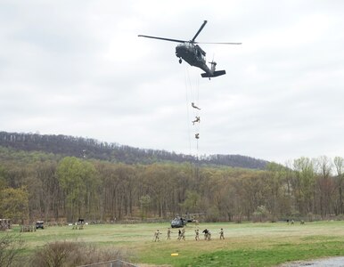 Soldiers rappel from a UH-60 Black Hawk helicopter during Air Assault School at Fort Indiantown Gap on April 15, 2021. Air Assault School is a 10-day course designed to prepare Soldiers for insertion, evacuation, and pathfinder missions that call for the use of multipurpose transportation and assault helicopters.