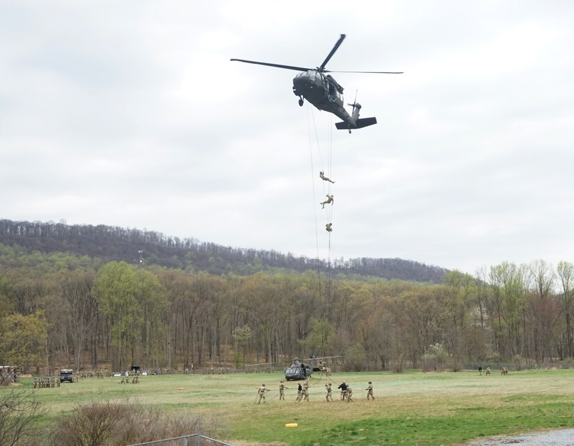 Soldiers rappel from a UH-60 Black Hawk helicopter during Air Assault School at Fort Indiantown Gap on April 15, 2021. Air Assault School is a 10-day course designed to prepare Soldiers for insertion, evacuation, and pathfinder missions that call for the use of multipurpose transportation and assault helicopters.