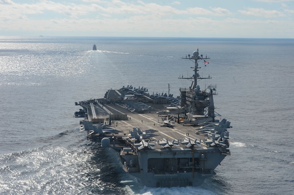 211013-N-FB730-1330 ATLANTIC OCEAN (Oct. 13, 2021) Carrier Strike Group (CSG) 8 transits the Atlantic Ocean during a restricted maneuvering exercise. Truman is operating in the Atlantic Ocean in support of naval operations to maintain maritime stability and security in order to ensure access, deter aggression and defend U.S., allied and partner interests. (U.S. Navy Photo by Mass Communication Specialist 3rd Class Justin Woods)